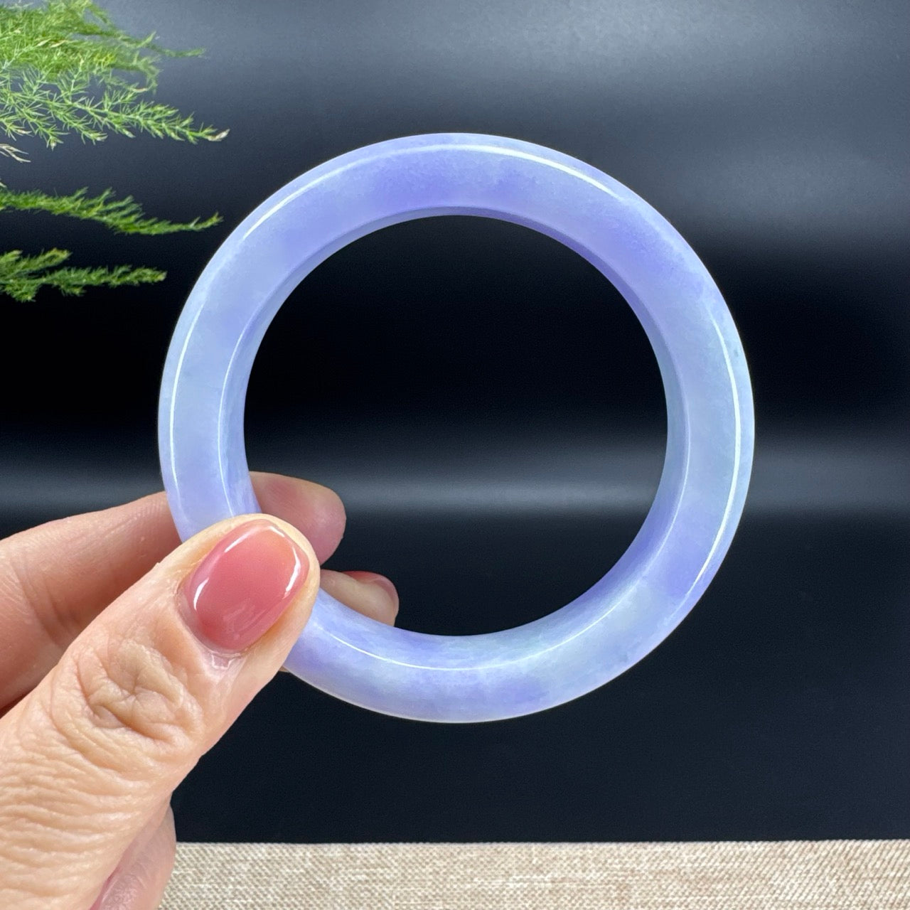 The bangle shape of the half round.The bangle color is lavender.
