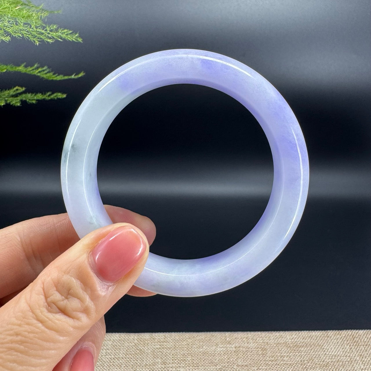 The bangle shape of the half round.The bangle color is lavender.