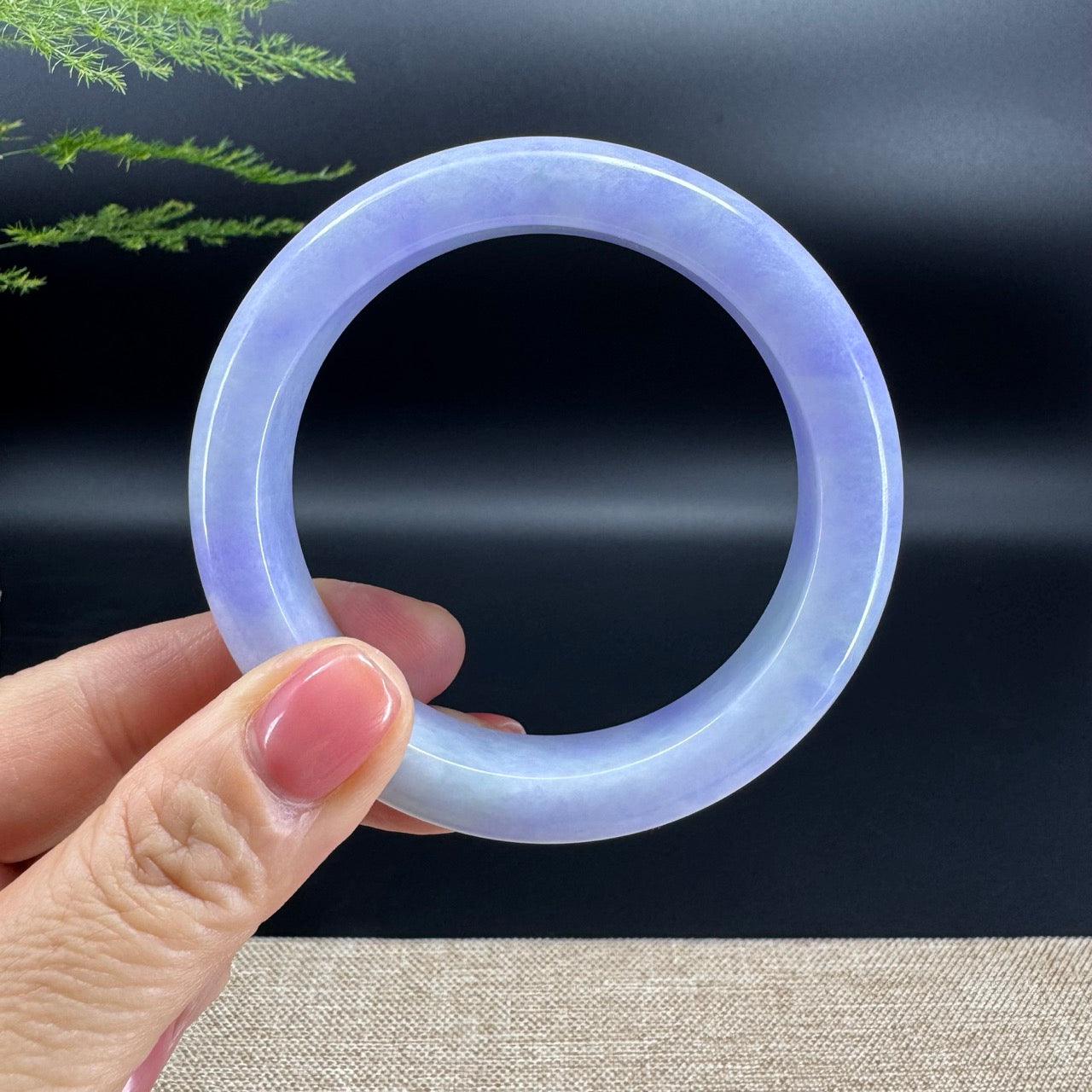 The bangle shape of the half round.The bangle color is lavender.