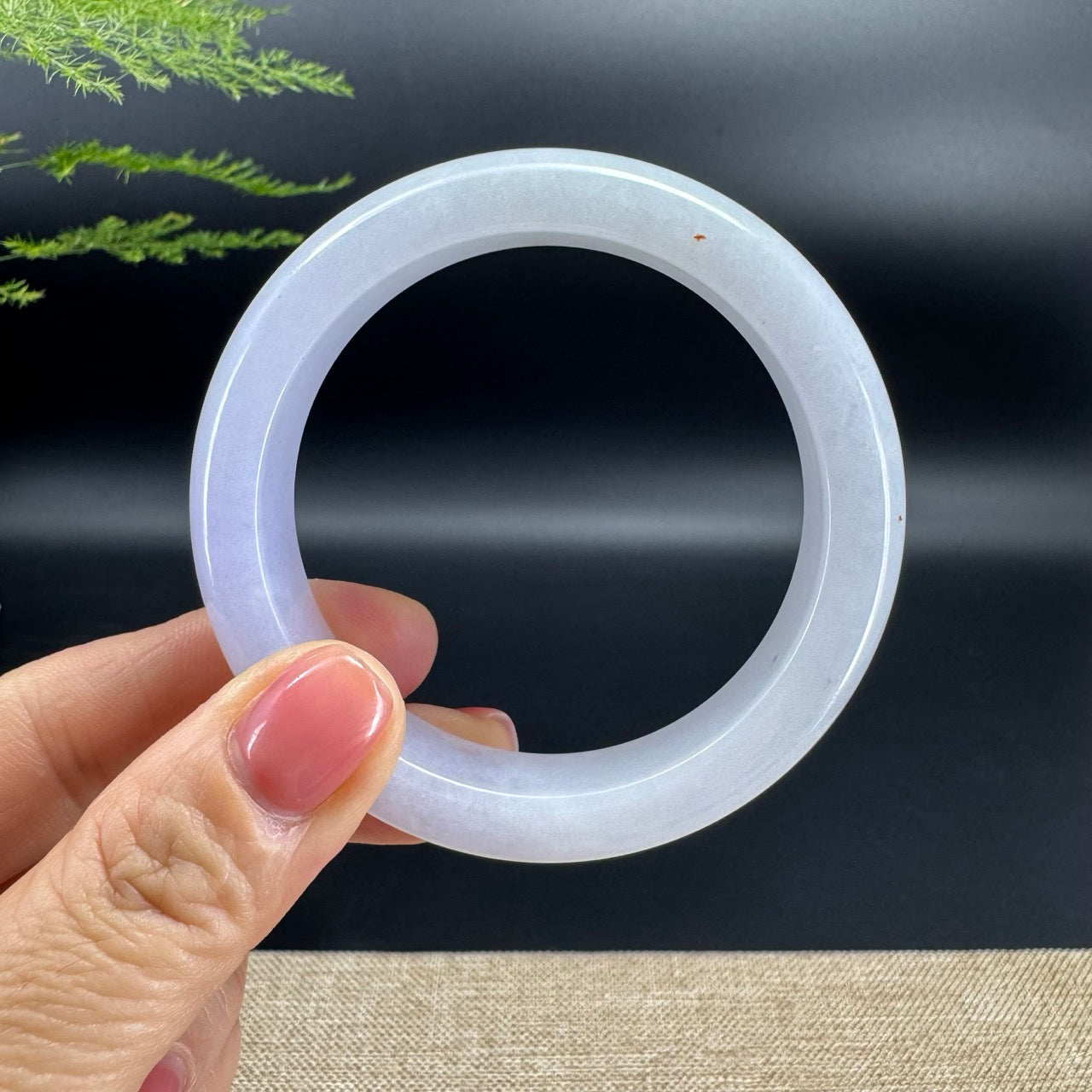 The bangle shape of the half round.The bangle color is lavender.