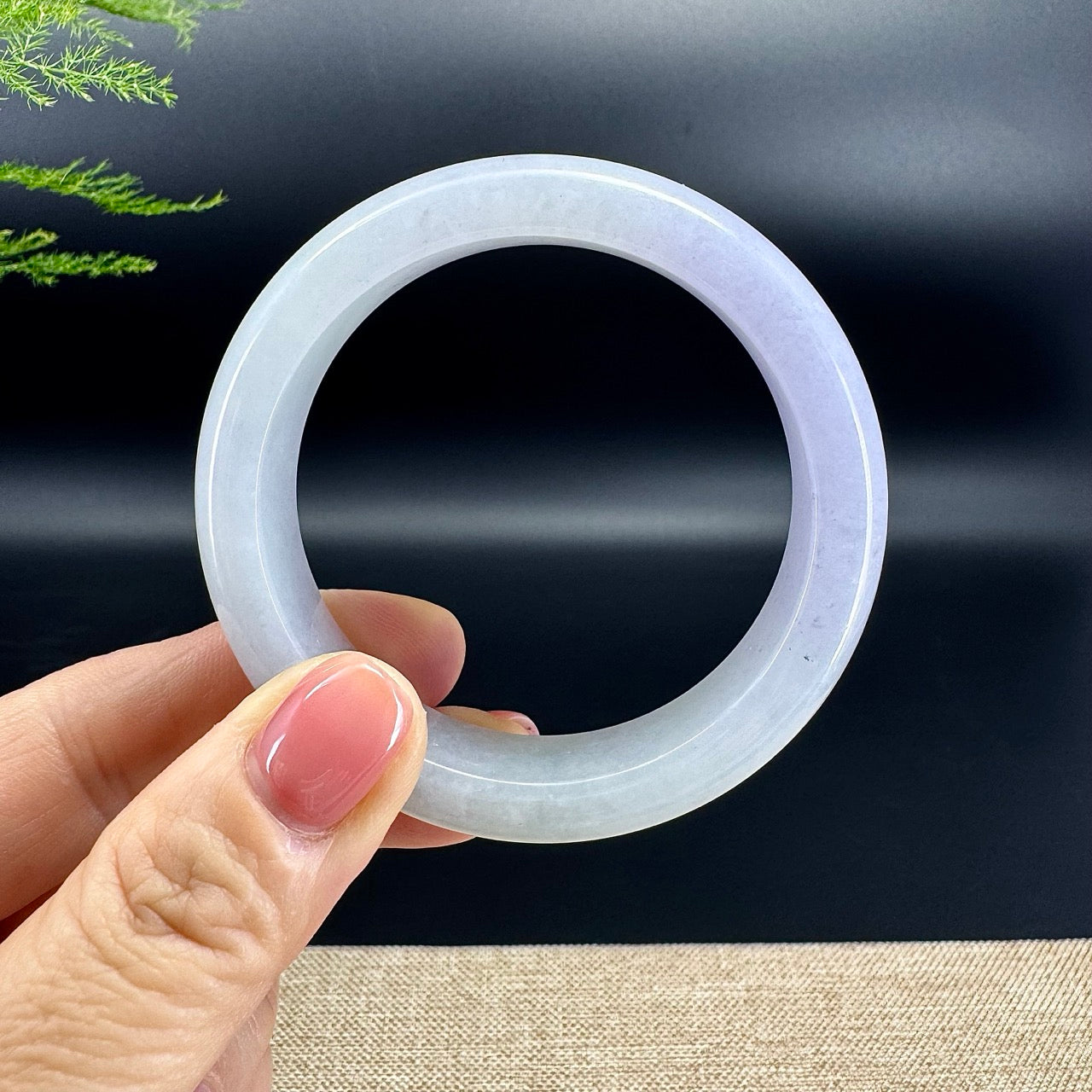 The bangle shape of the half round.The bangle color is lavender green.