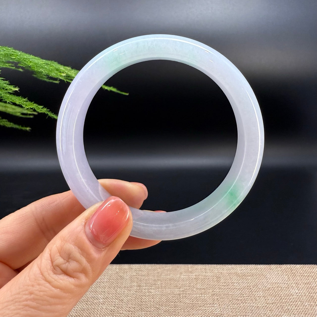The bangle shape of the half round.The bangle color is icy pink green.