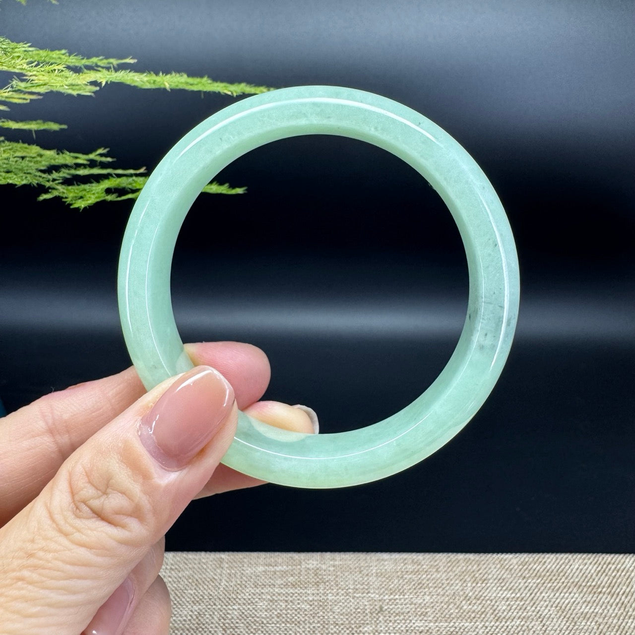 The bangle shape of the half round.The bangle color is icy apple green and some wuji.