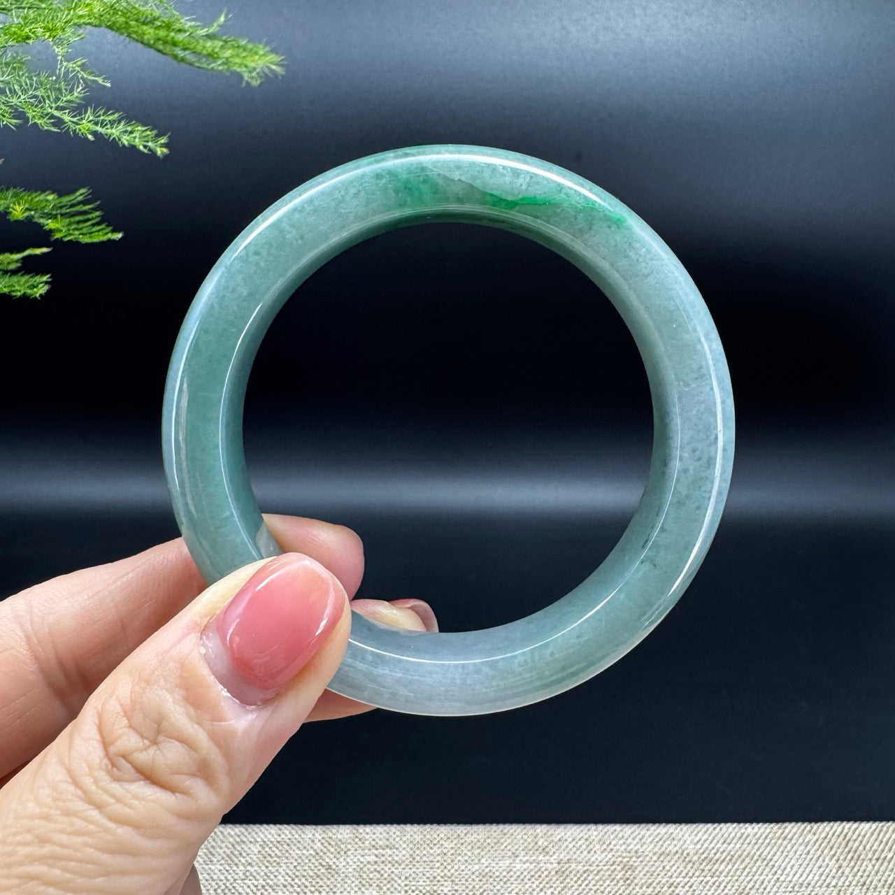 The bangle shape of the half round.The bangle color is green