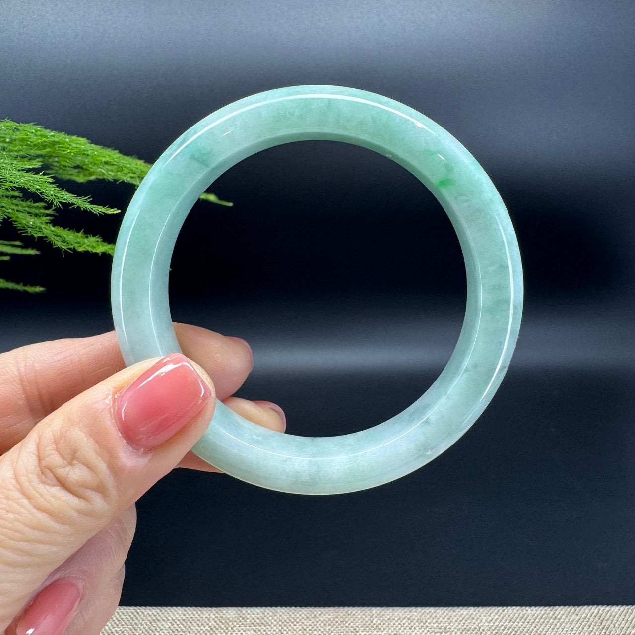 The bangle shape of the half round.The bangle color is green.