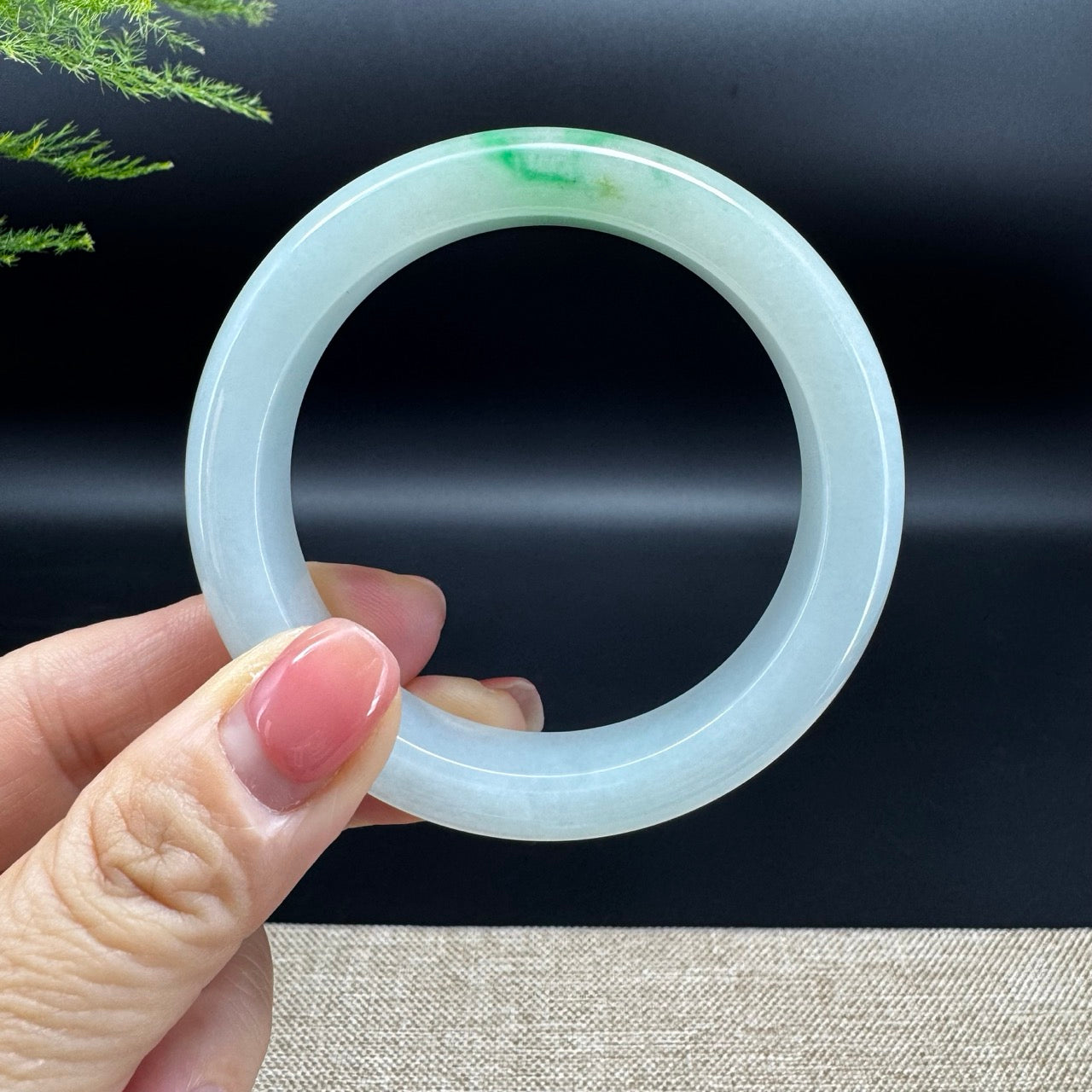 The bangle shape of the half round.The bangle color is icy green.