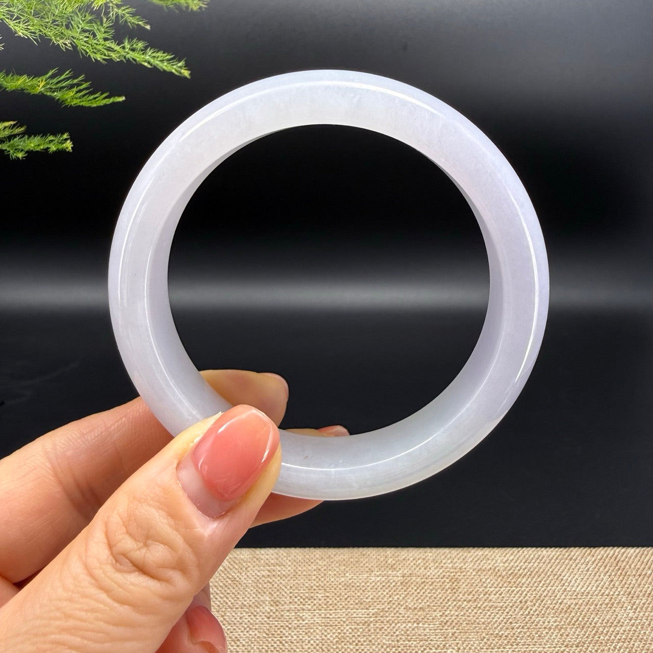The bangle shape of the half round.The bangle color is light lavender.