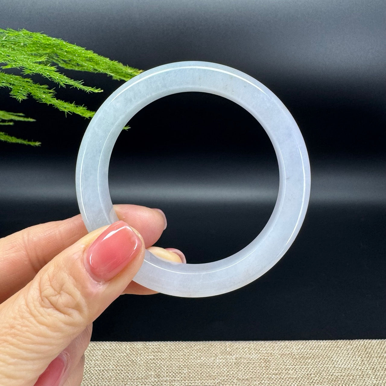The bangle shape of the half round.The bangle color is icy green.