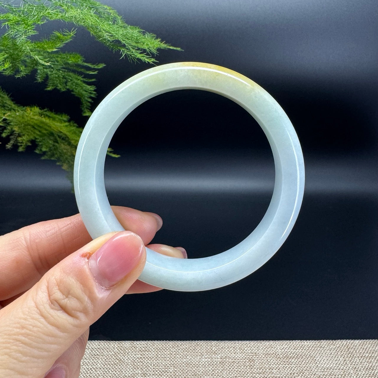 The bangle shape of the half round.The bangle color is yellow green.