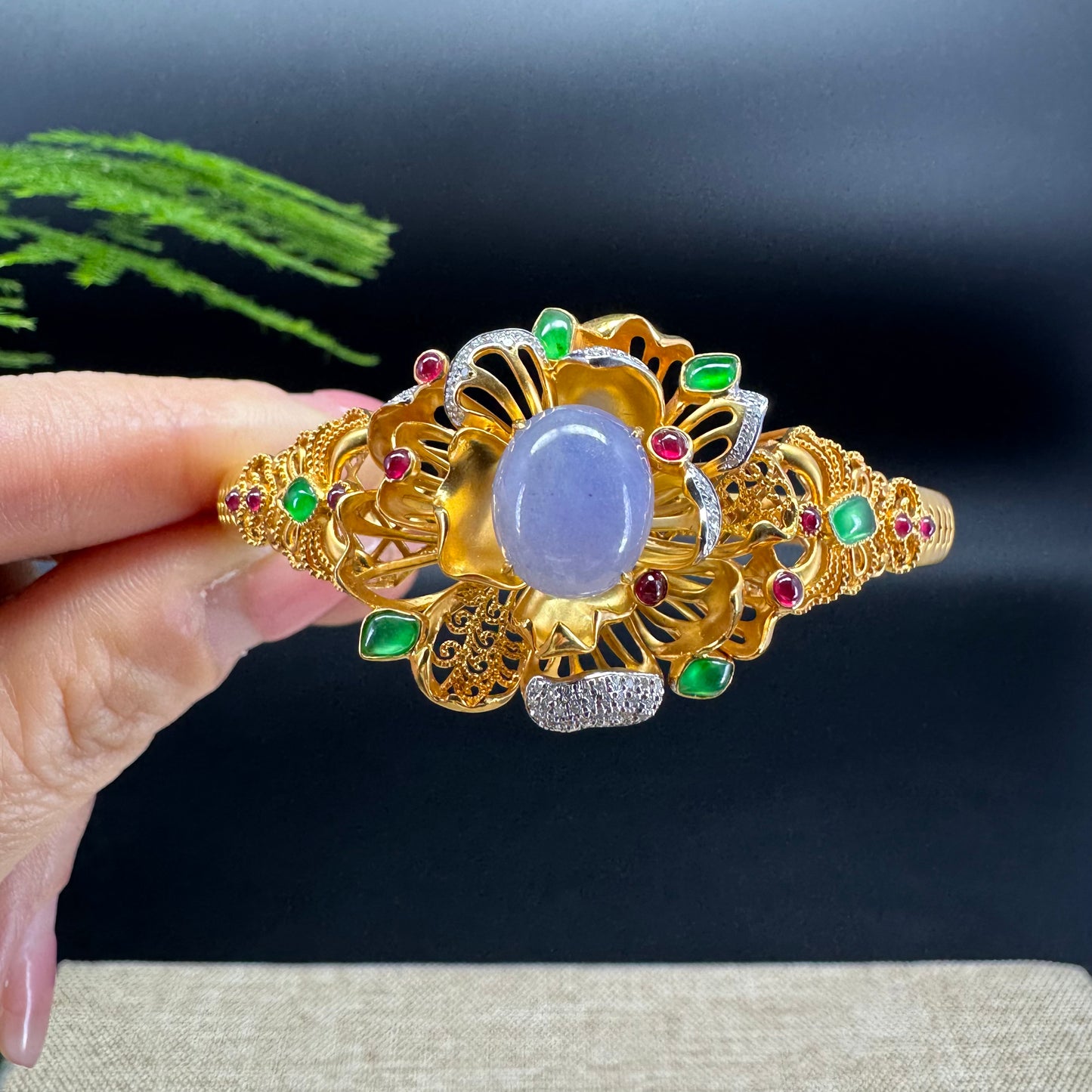  This bracelet blends the rich lavender and imperial green tones with the deep small red jade. 