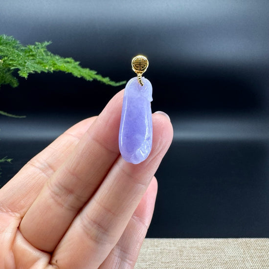 The shape of the pendant is that of a lucky bag. The jade is lavender color, and it is surrounded by 18k yellow gold.