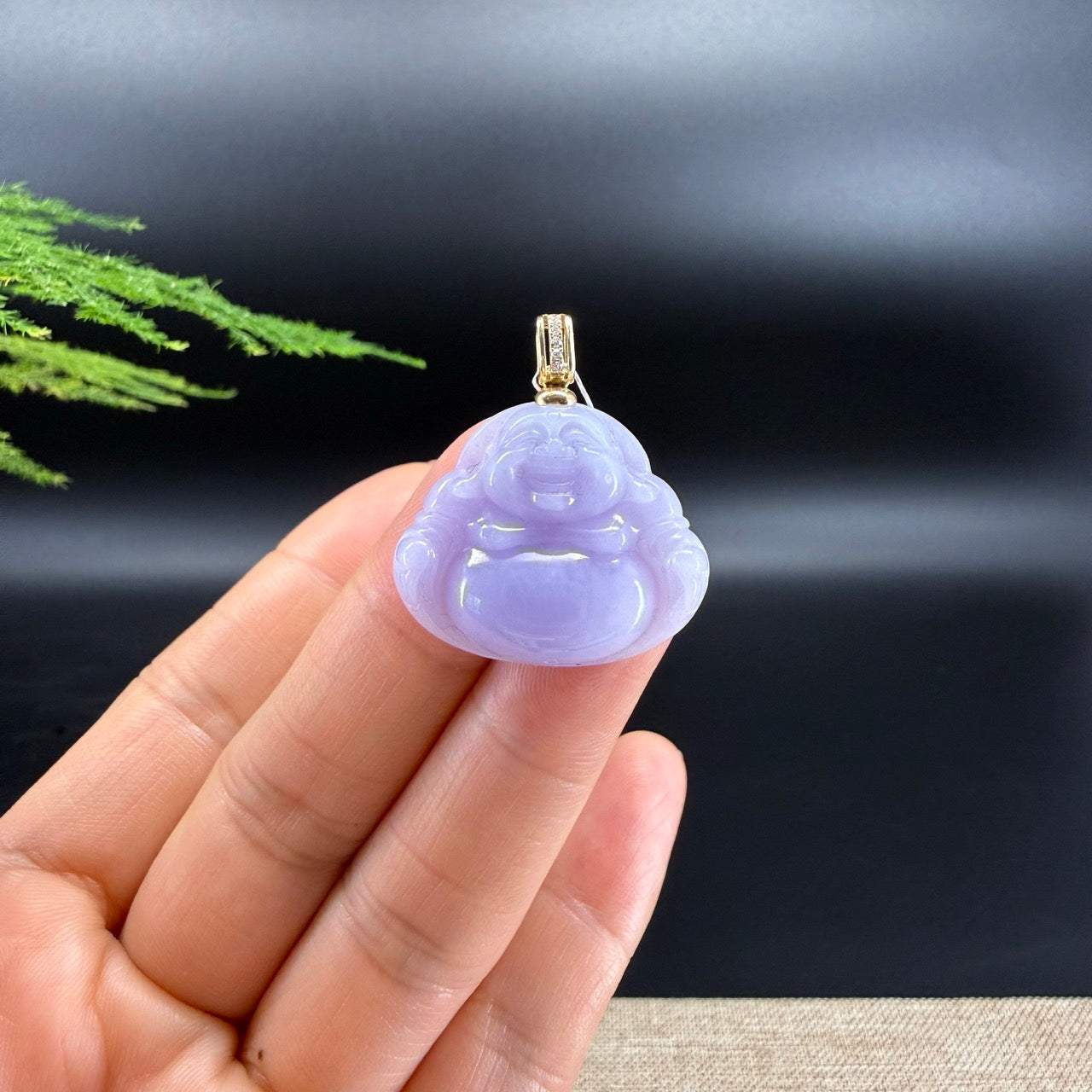 The pendant shape of the buddha.The pendant color is icy lavender.