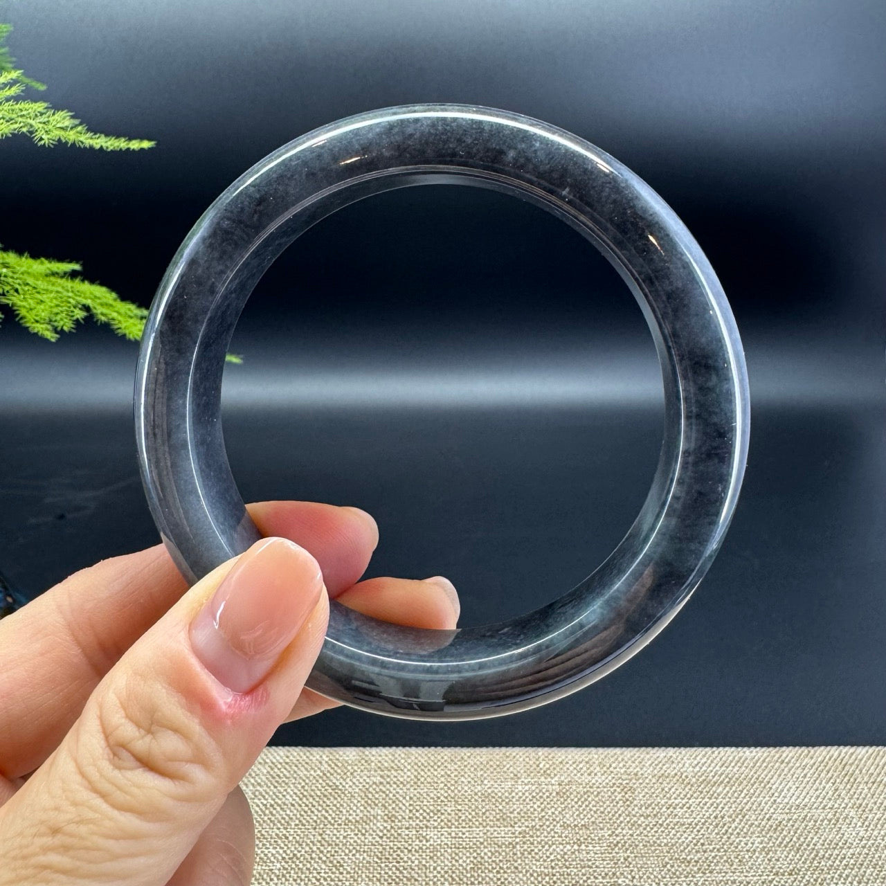 The bangle shape of the half round.The bangle color is black wuji.