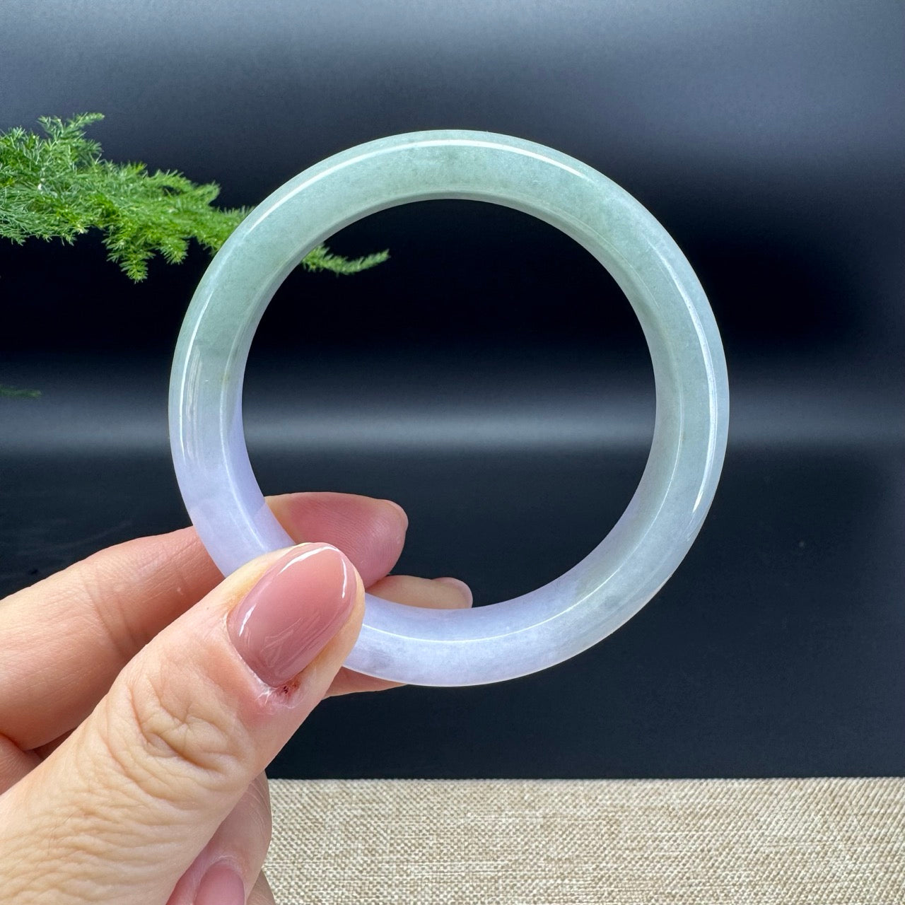 The bangle shape of the half round.The bangle colors are lavender and green.