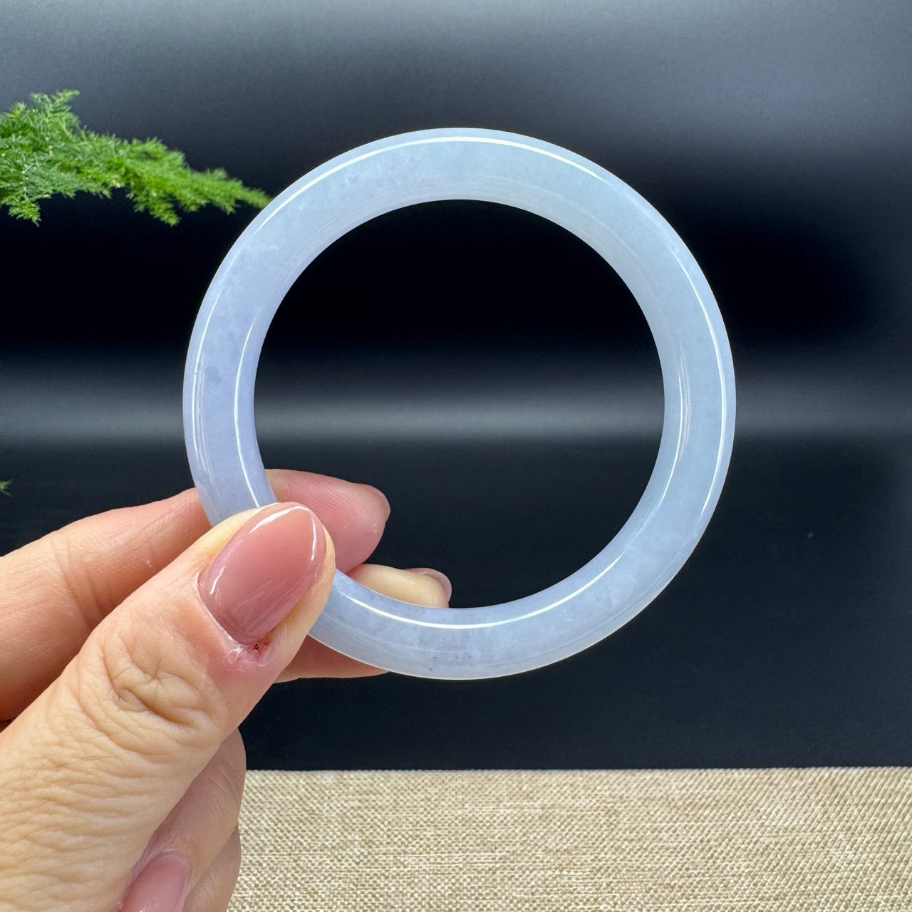 The bangle shape of the round.The bangle is lavender.