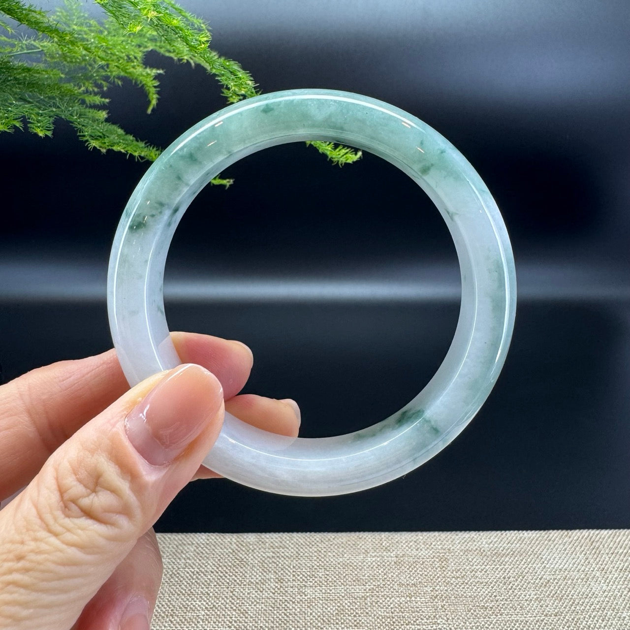 The bangle shape of the half round.The bangle color is lavender green. 