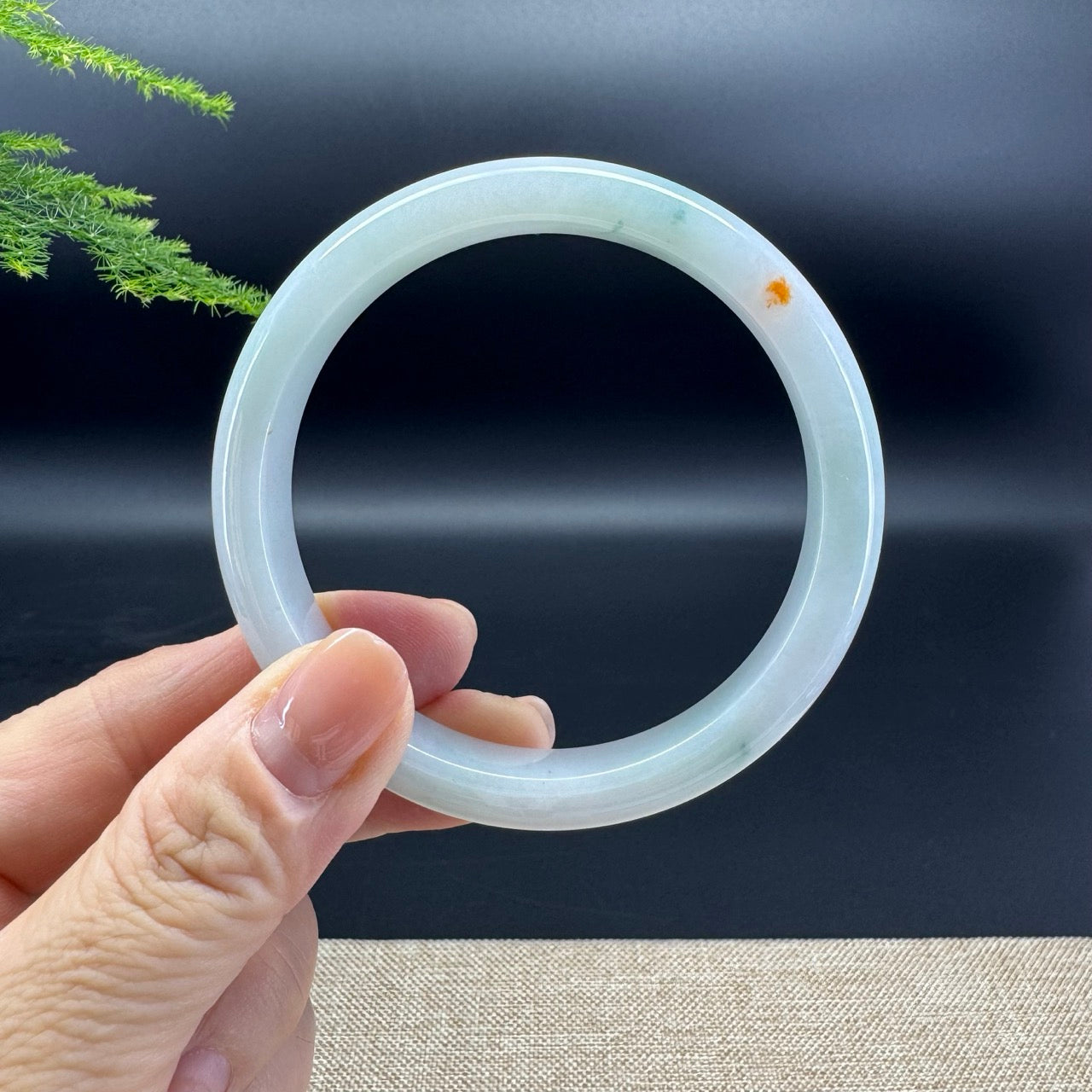 The bangle shape of the half round.The bangle color is icy green and a bit of sajin.