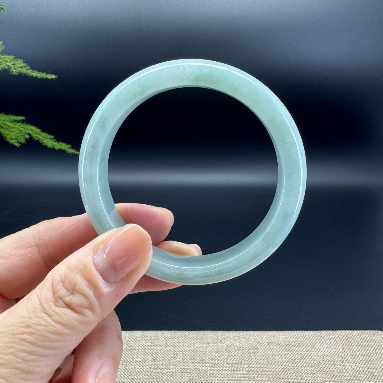 The bangle shape of the half round.The bangle color is apple green.
