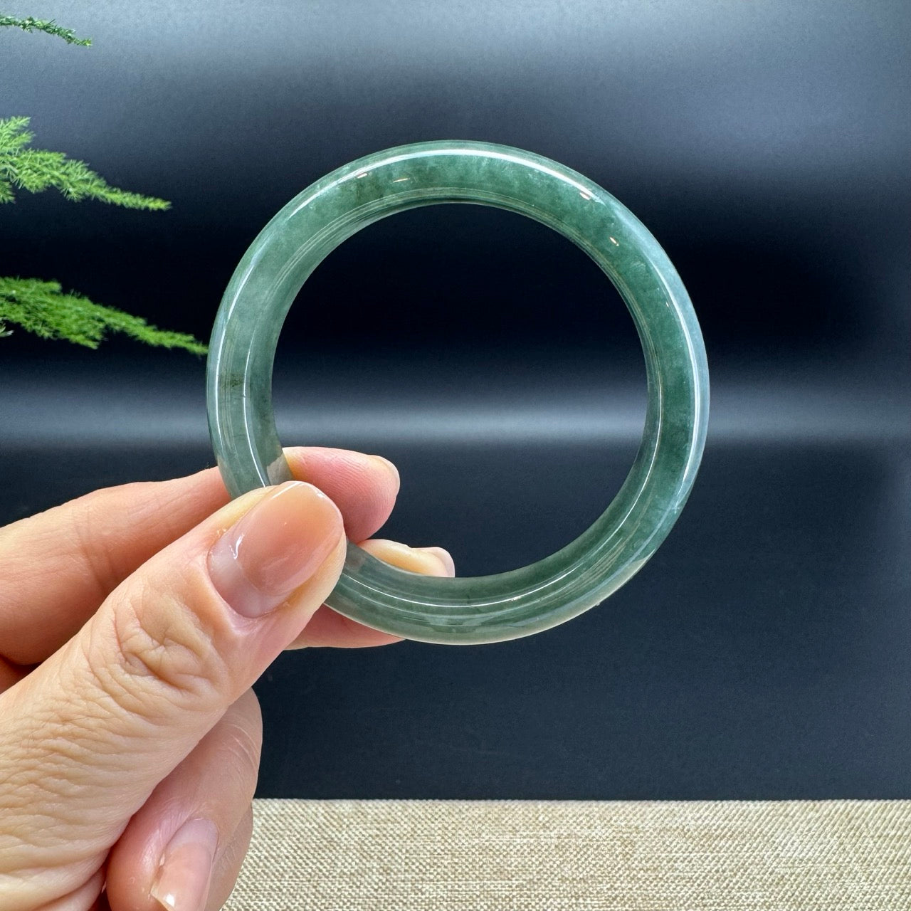 The bangle shape of the half round.The bangle color is oil green.