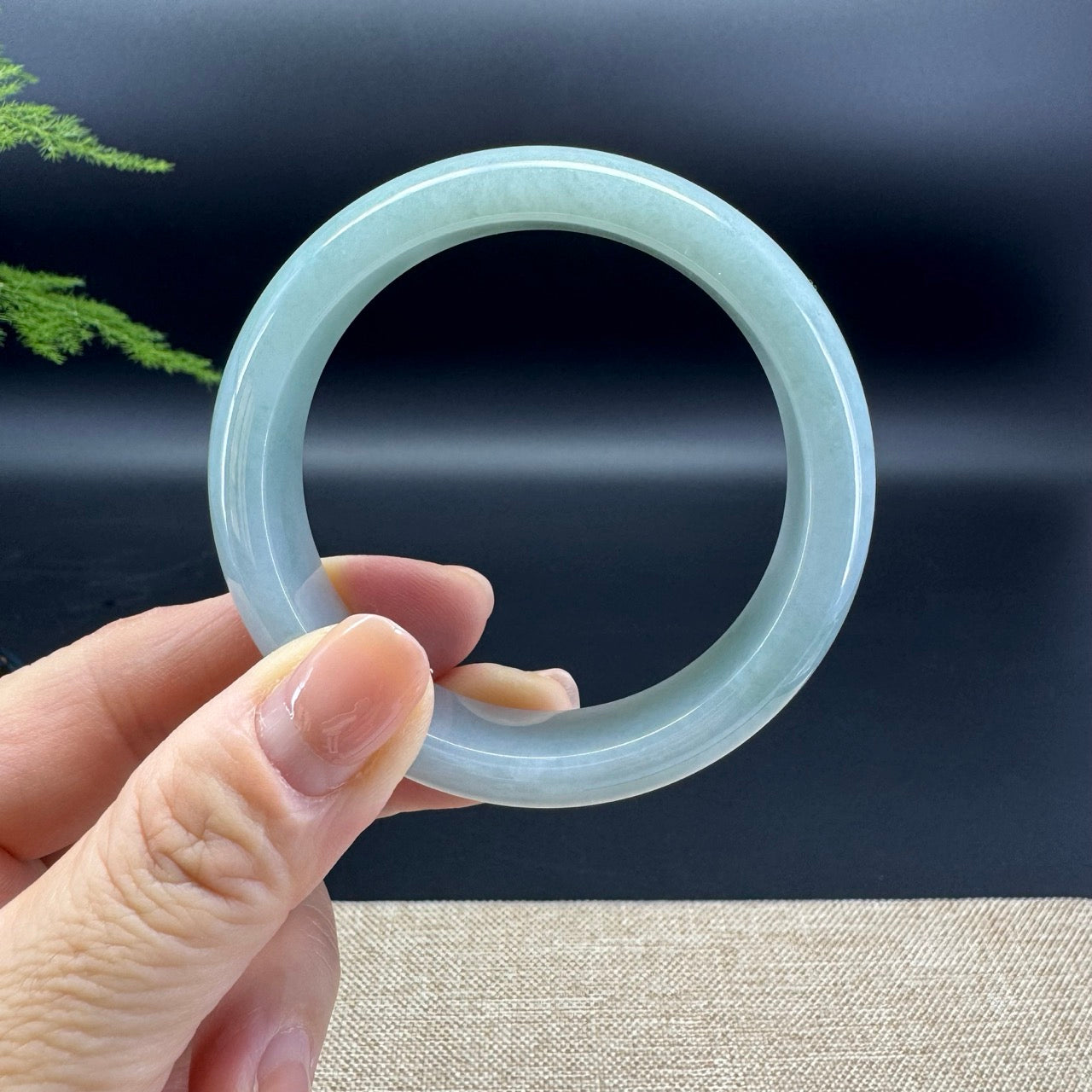 The bangle shape of the half round.The bangle color is icy green.