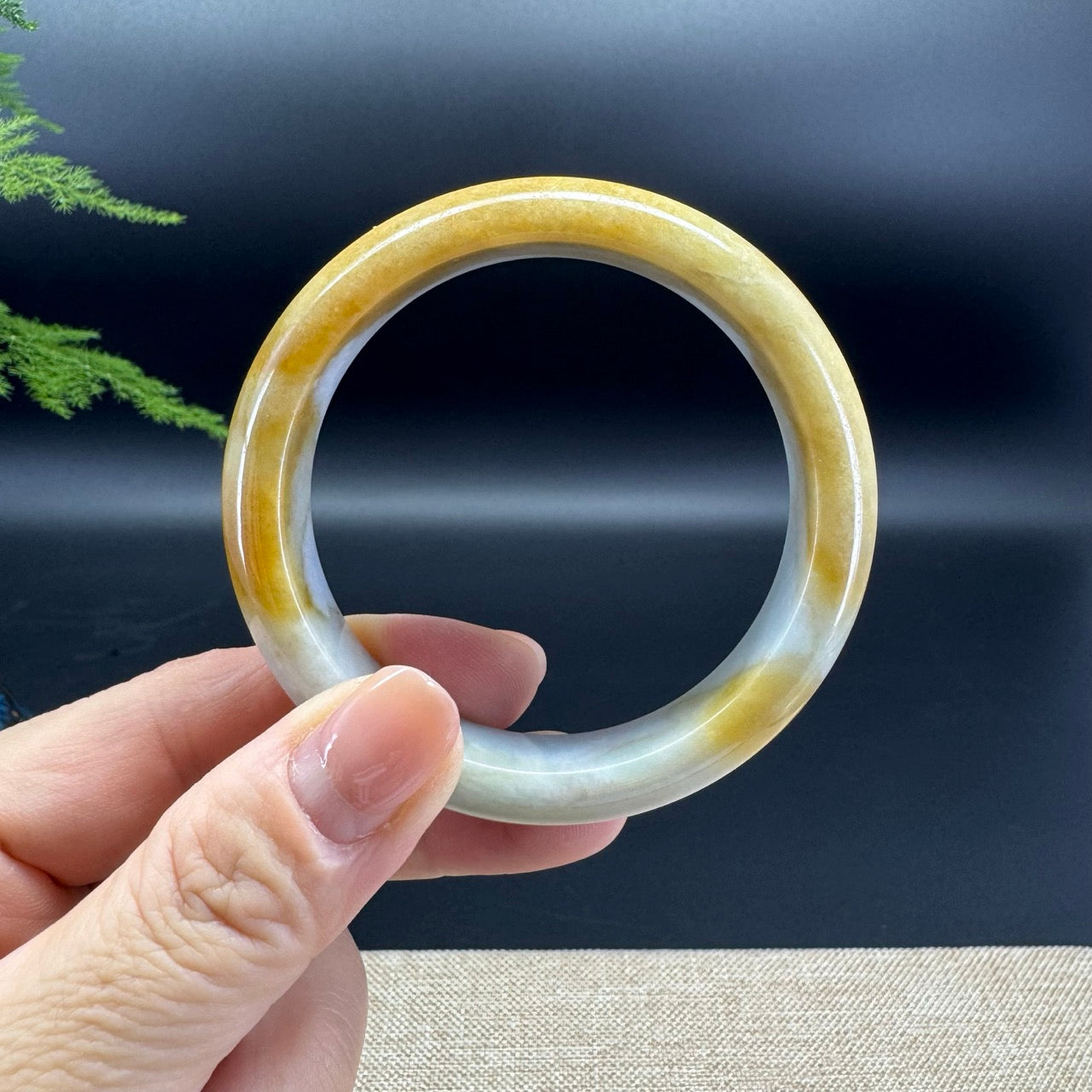 The bangle shape of the half round.The bangle color is yellow green.