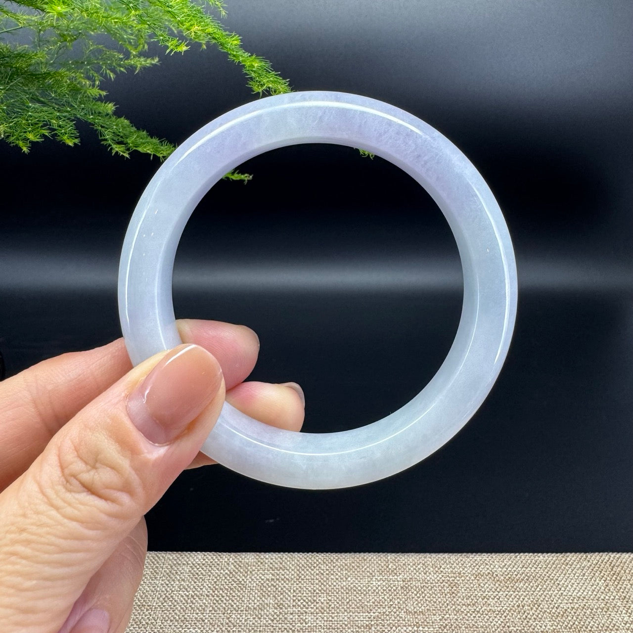 The bangle shape of the half round.The bangle color is lavender.