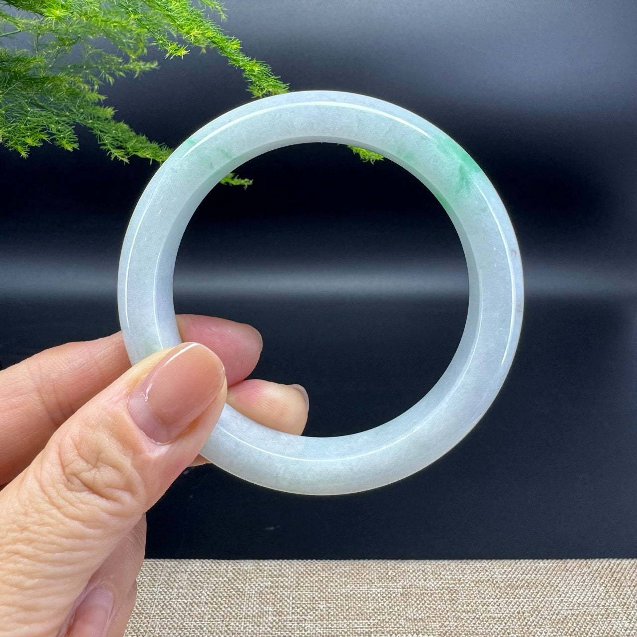 The bangle shape of the half round.The bangle color is icy green.