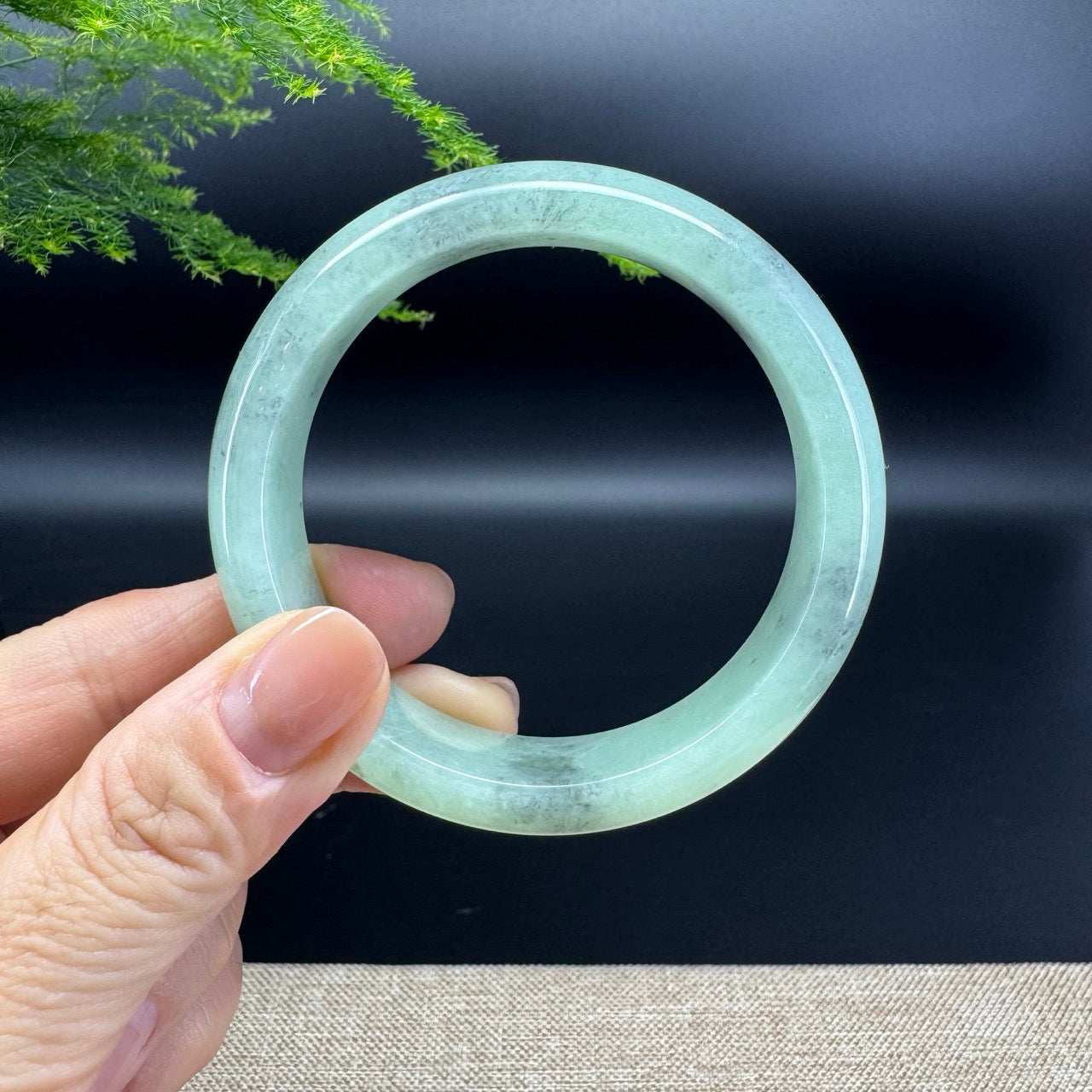 The bangle shape of the half round.The bangle color is apple green.