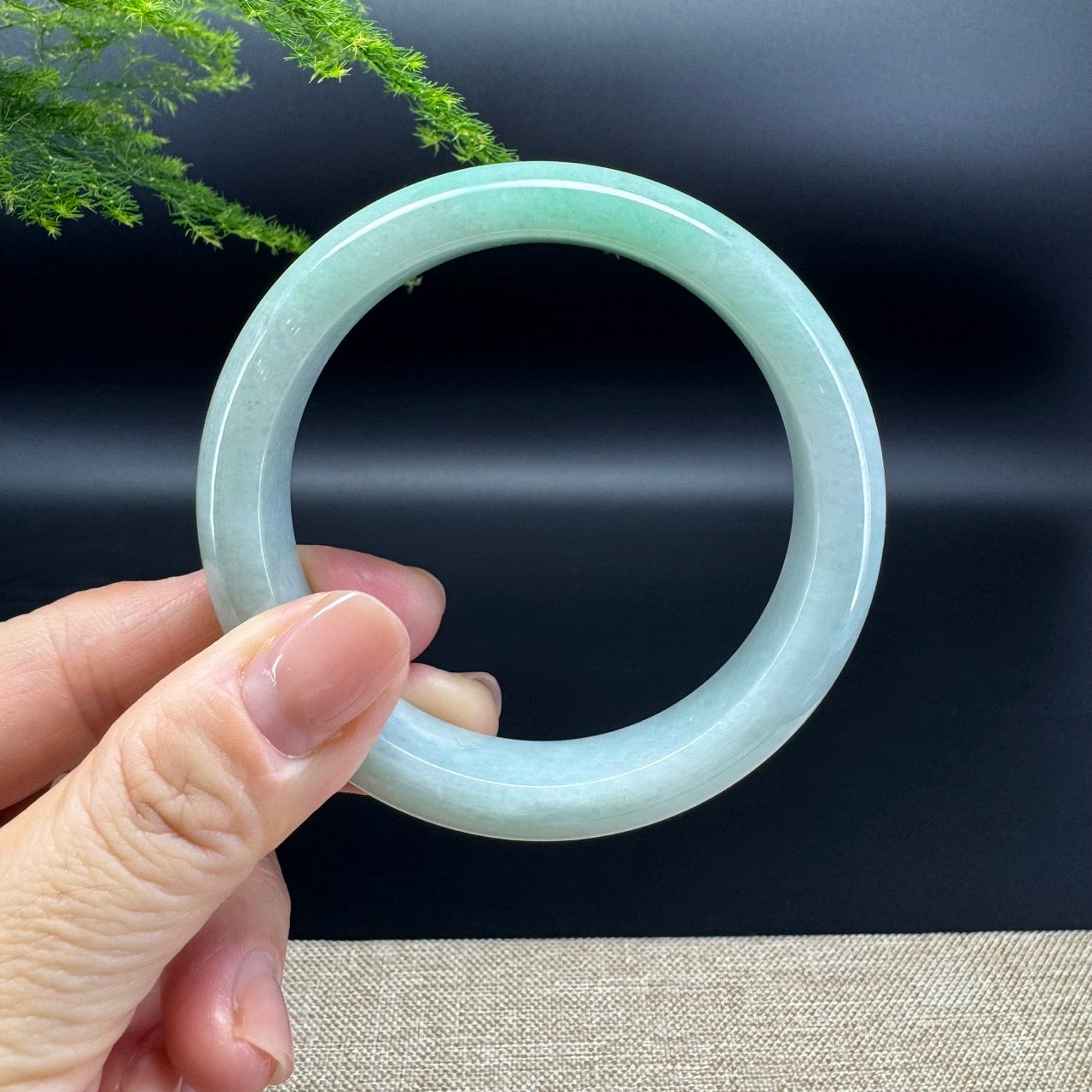 The bangle shape of the half round.The bangle color is icy green.