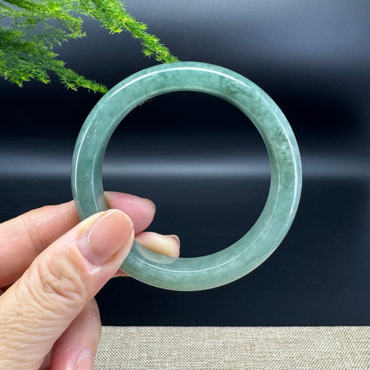The bangle shape of the half round.The bangle color is oil green.