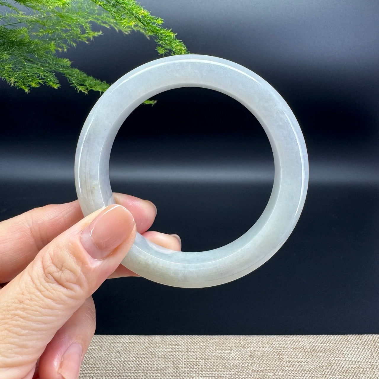 The bangle shape of the half round.The bangle color is lavender green.