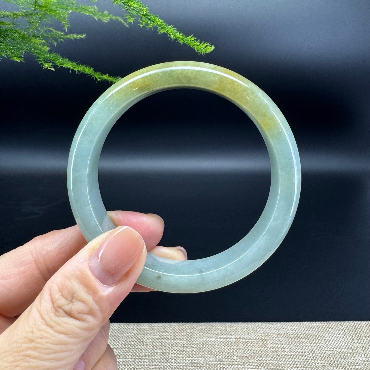 The bangle shape of the half round.The bangle color is icy yellow green.