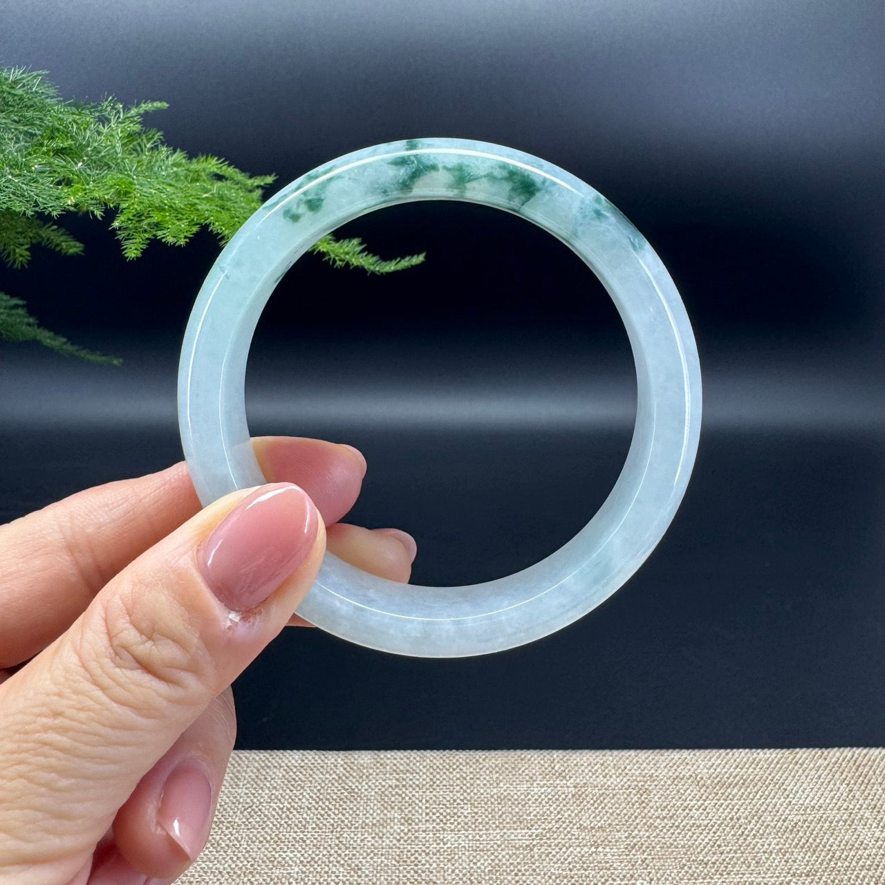 The bangle shape of the half round.The bangle color is icy oil green.