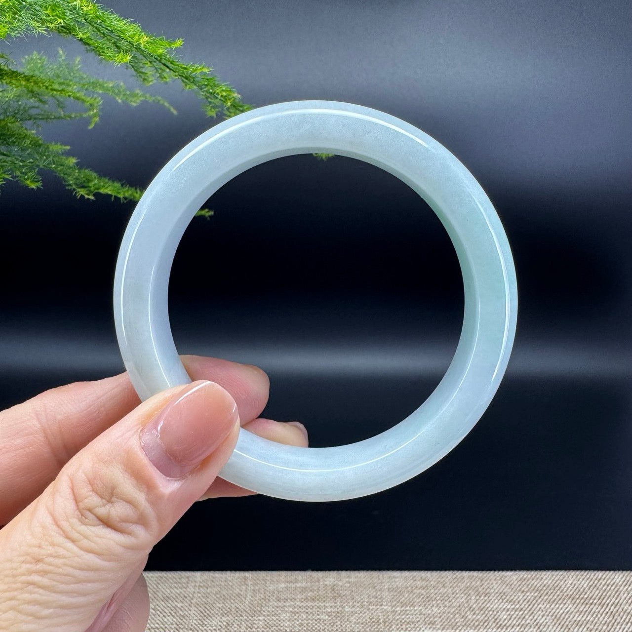 The bangle shape of the half round.The bangle color is green.