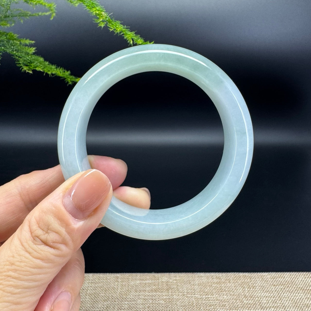 The bangle shape of the half round.The bangle color is icy green.
