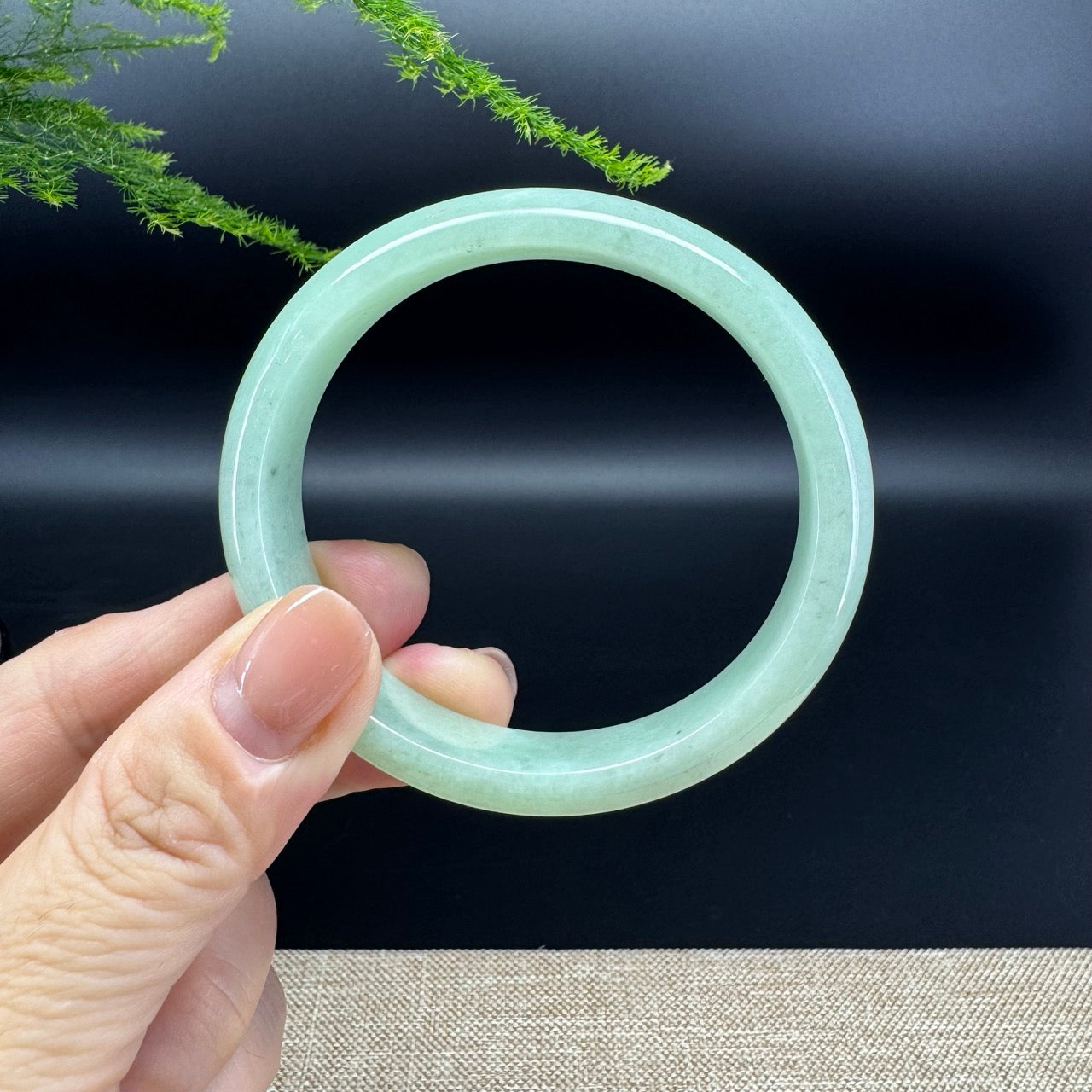 The bangle shape of the half round.The bangle color is apple green.
