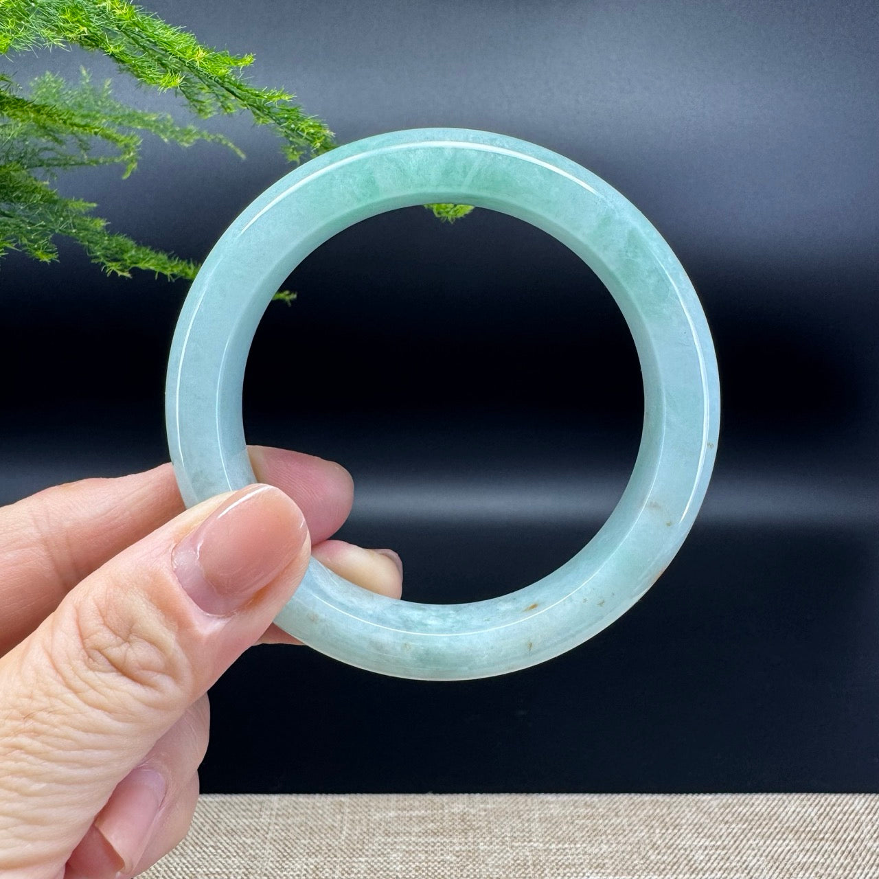The bangle shape of the half round.The bangle color is green.