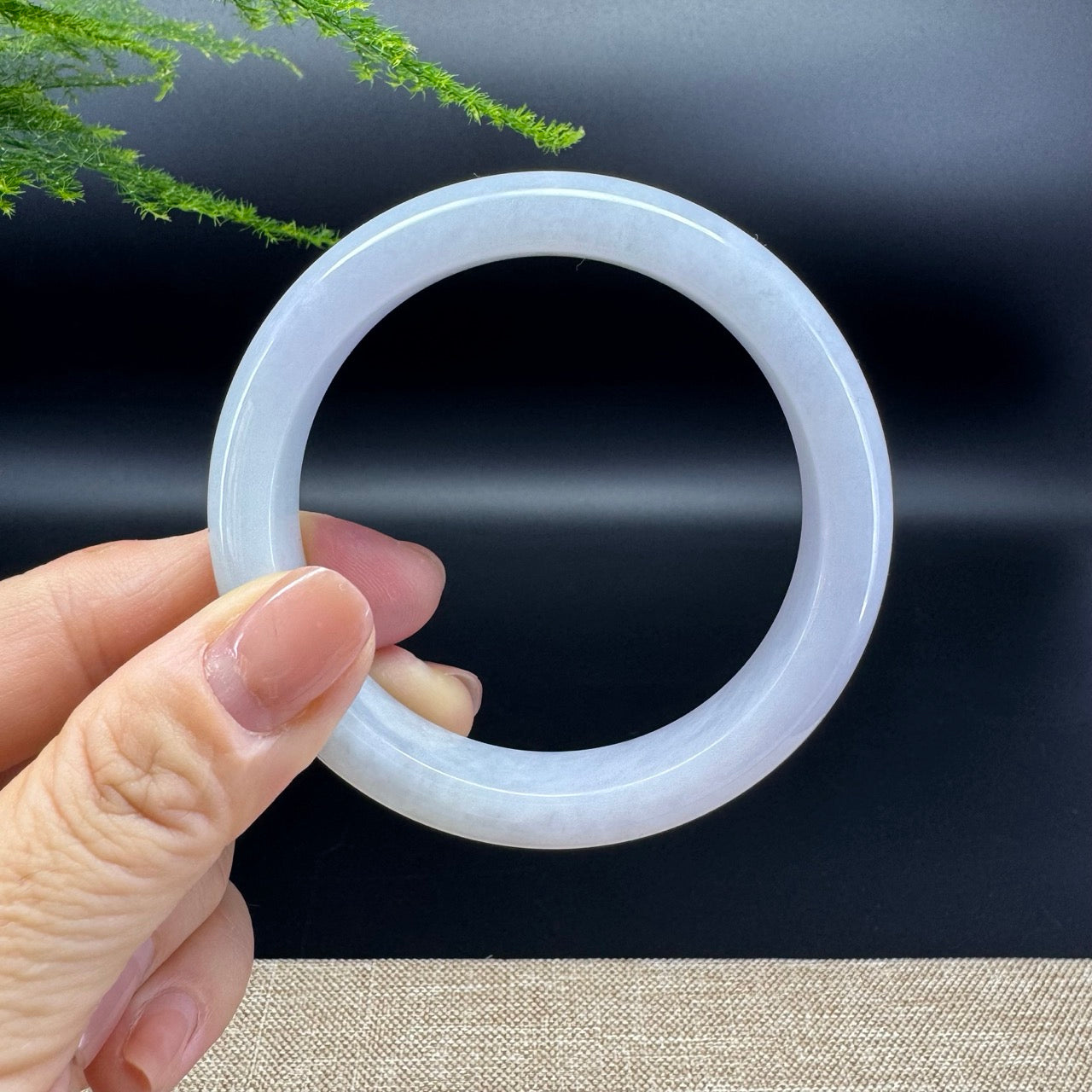 The bangle shape of the half round.The bangle color is lavender green.