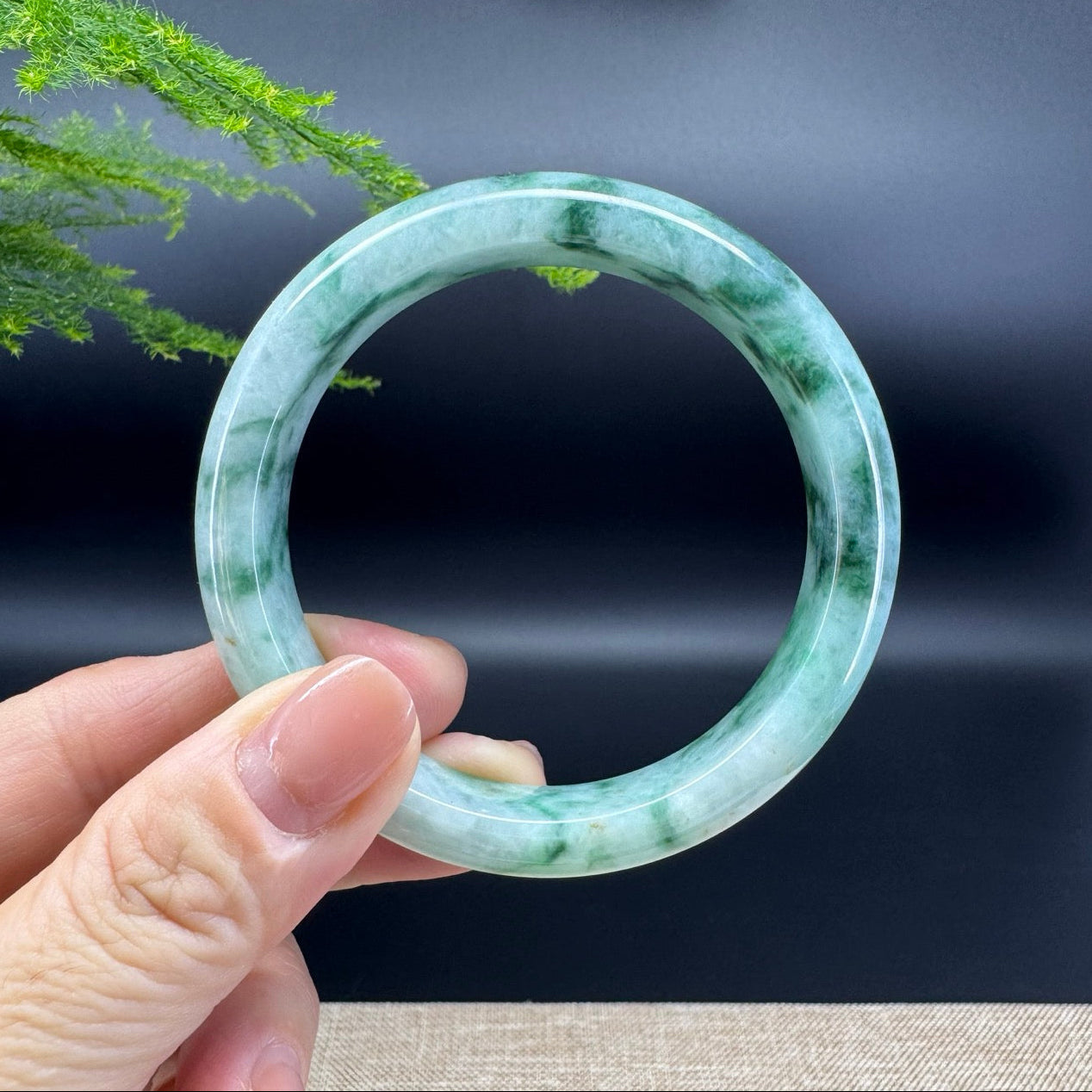 The bangle shape of the half round.The bangle color is icy green.