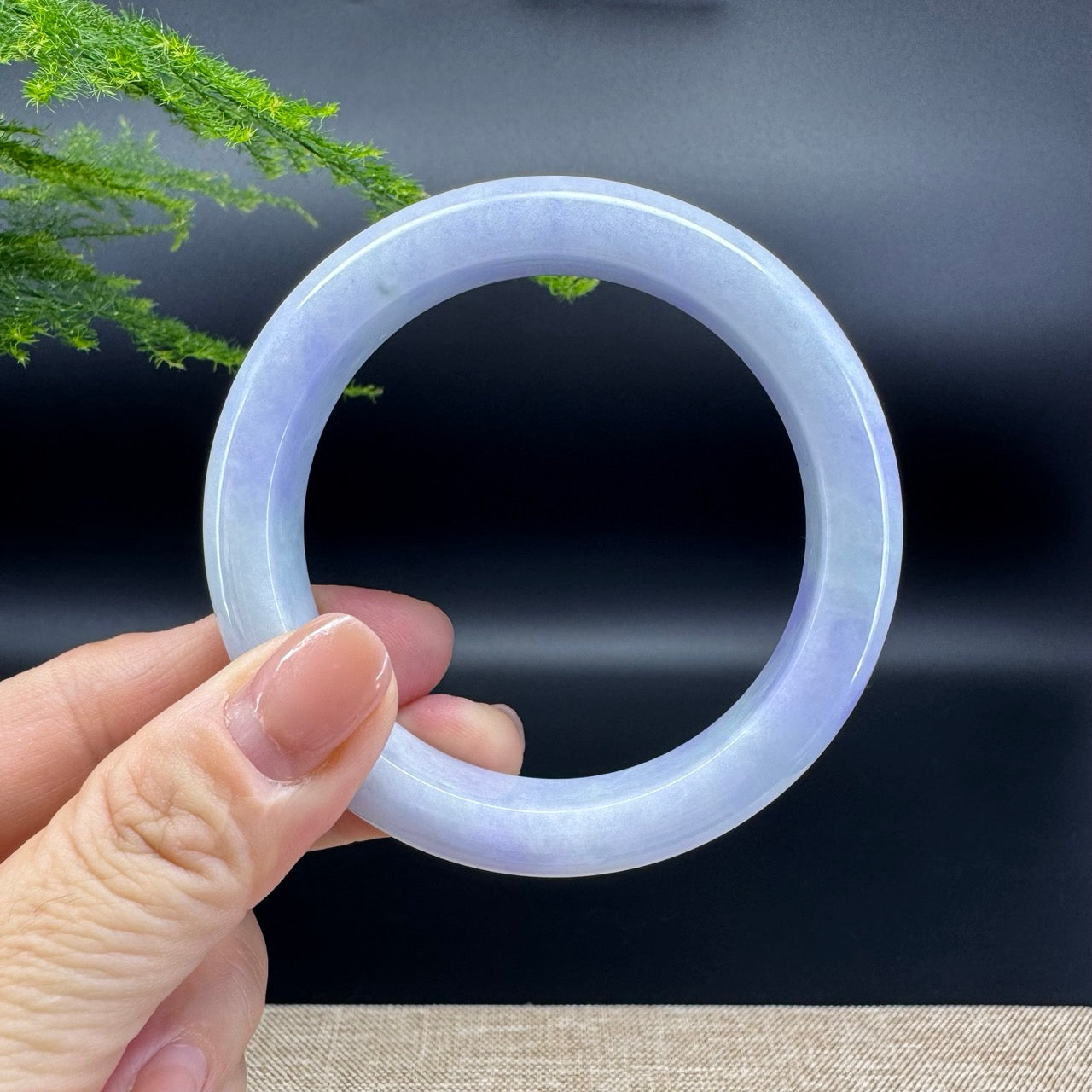 The bangle shape of the half round.The bangle color is lavender.