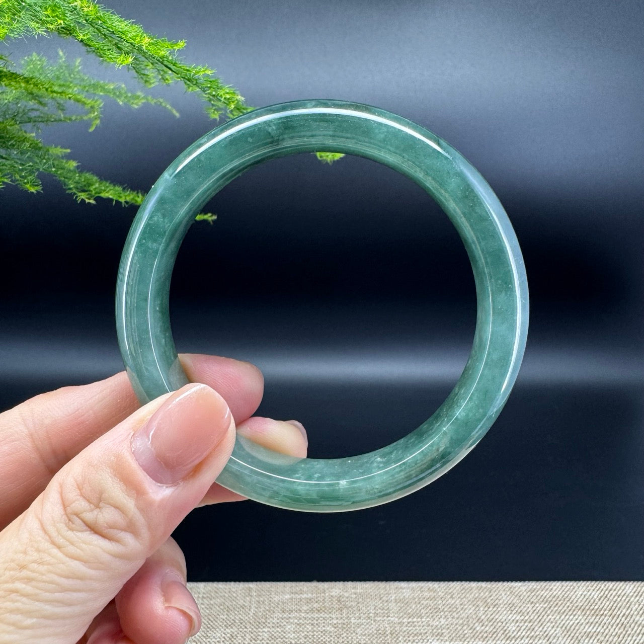 The bangle shape of the half round.The bangle color is icy oil green.