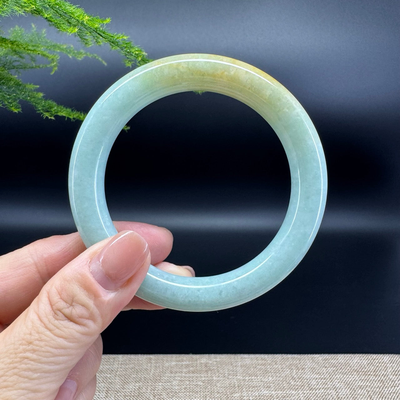 The bangle shape of the round.The bangle color is yellow green.