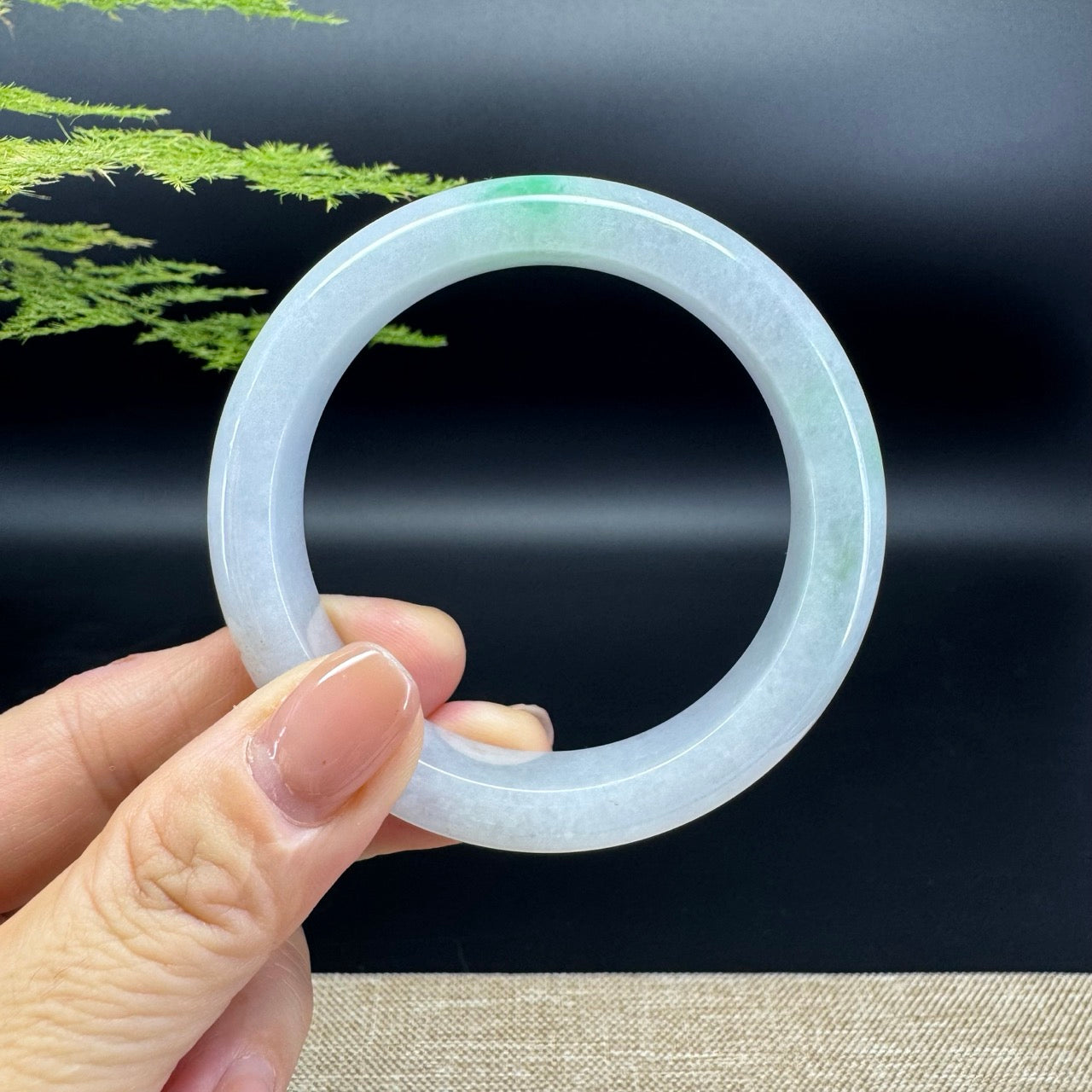 The bangle shape of the half round.The bangle color is icy green.