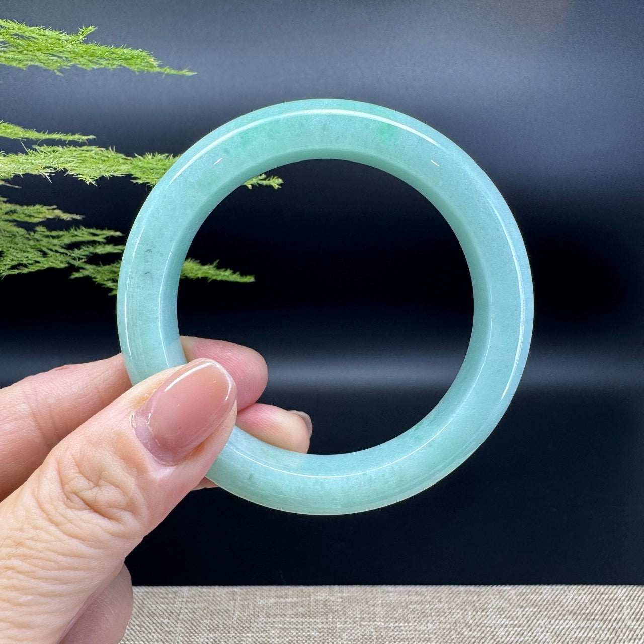 The bangle shape of the half round.The bangle color is apple green.