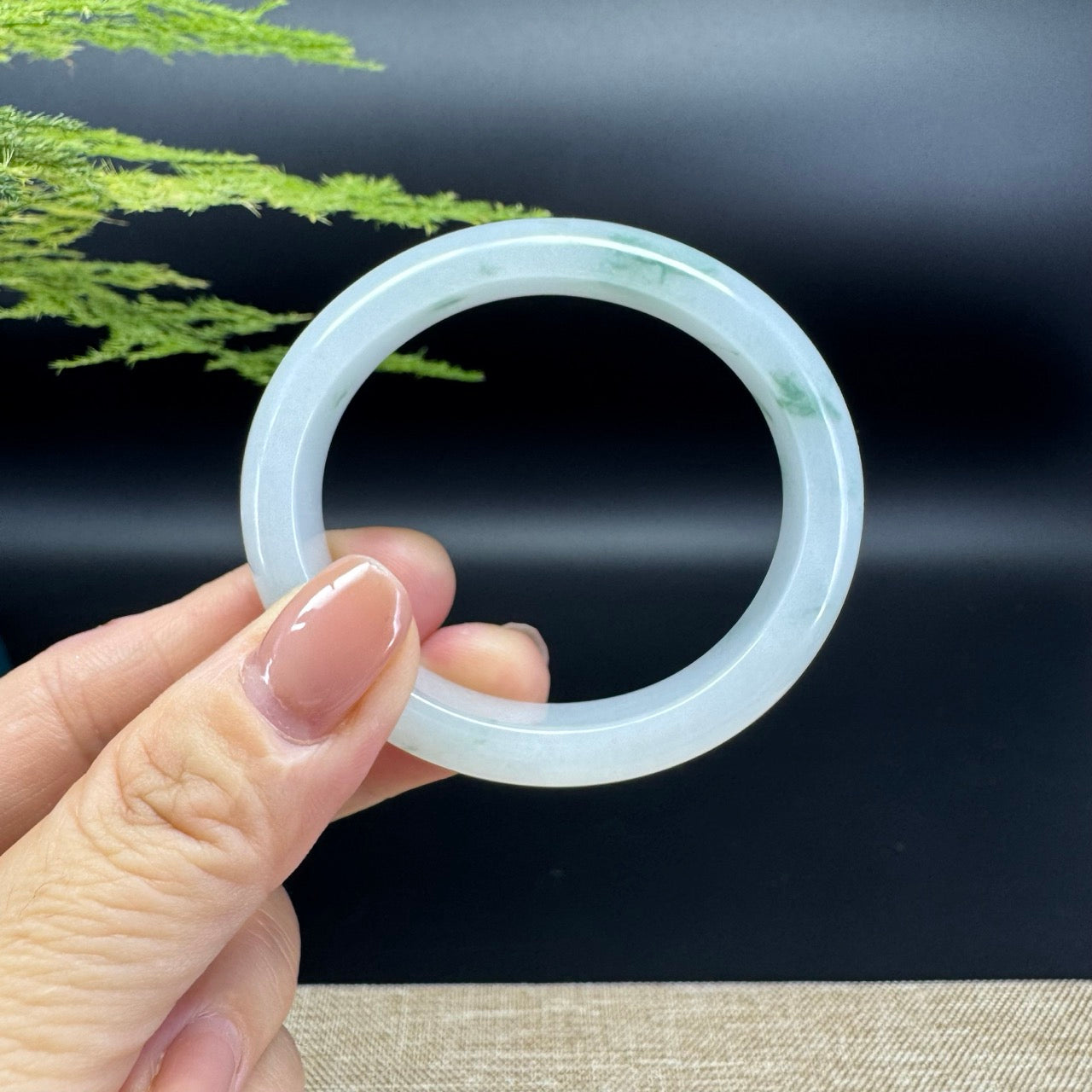 The bangle shape of the half round.The bangle color is icy green.