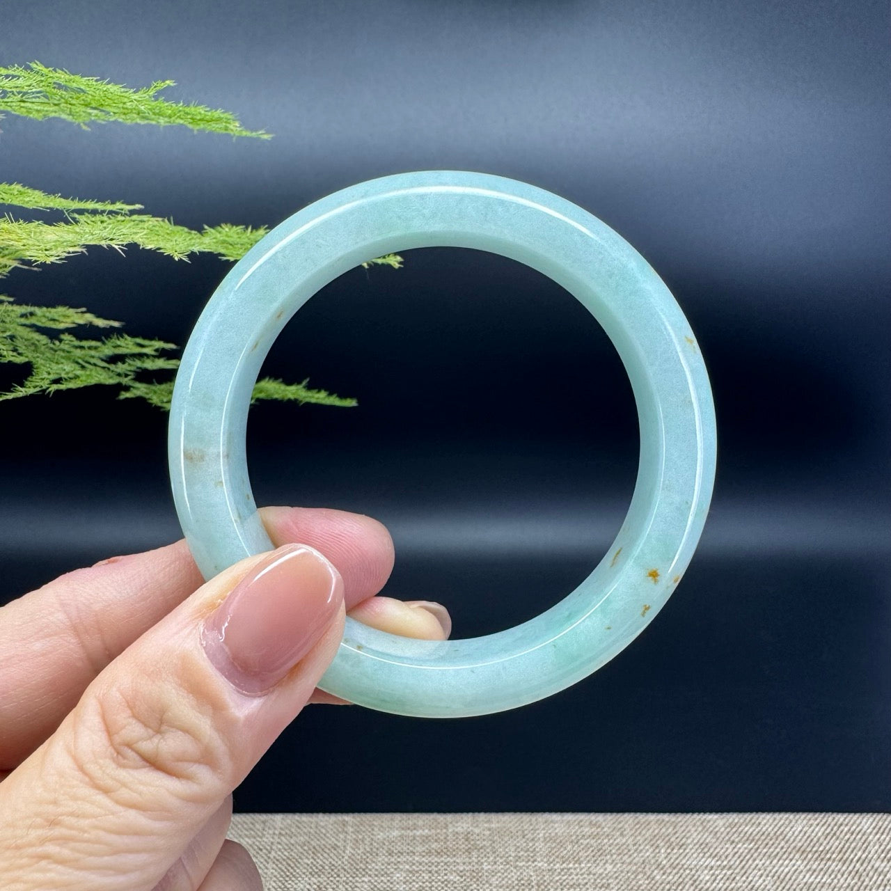 The bangle shape of the half round.The bangle color is apple green.