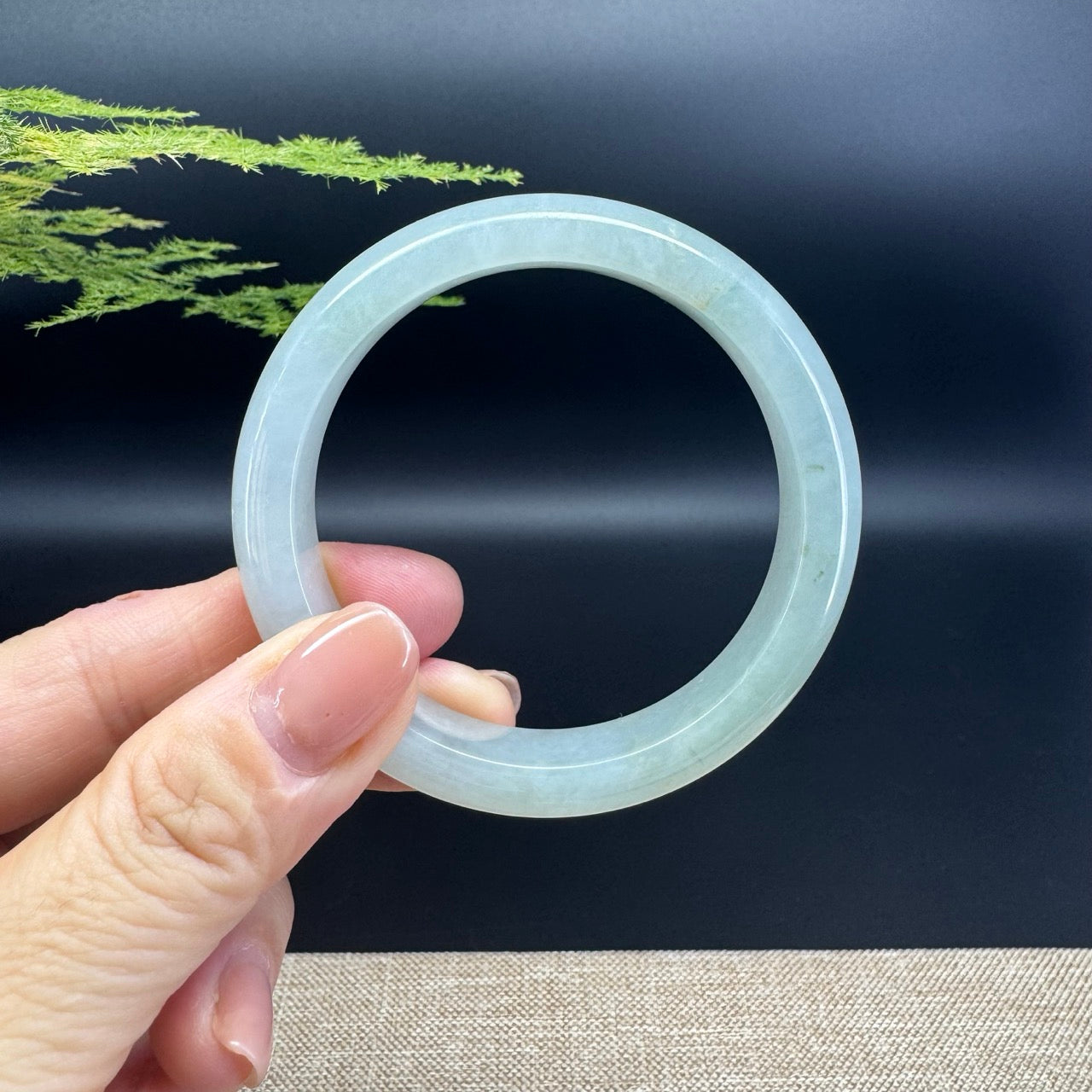 The bangle shape of the half round.The bangle color is icy green.