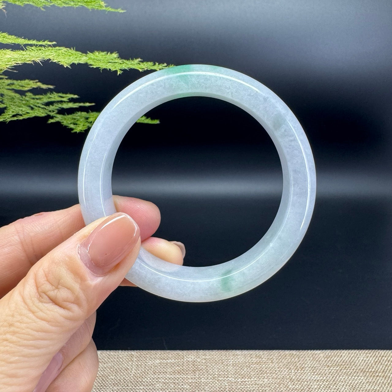 The bangle shape of the half round.The bangle color is light lavender green.