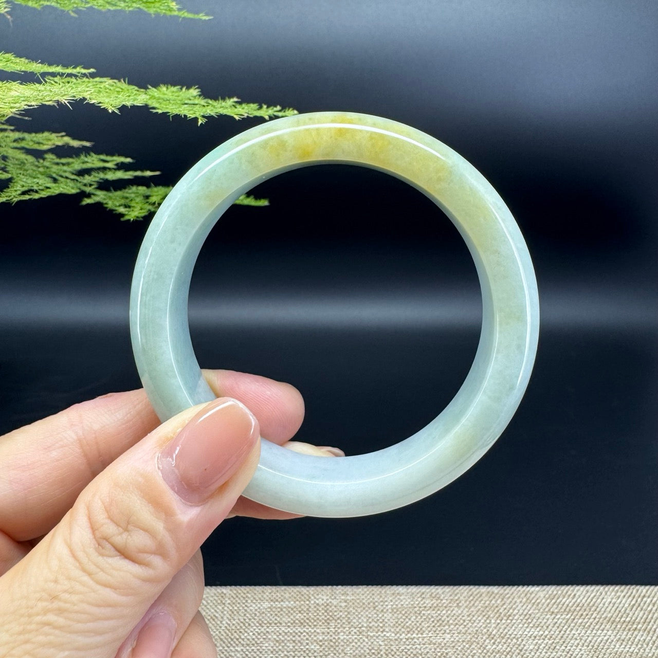 The bangle shape of the half round.The bangle color is yellow green.