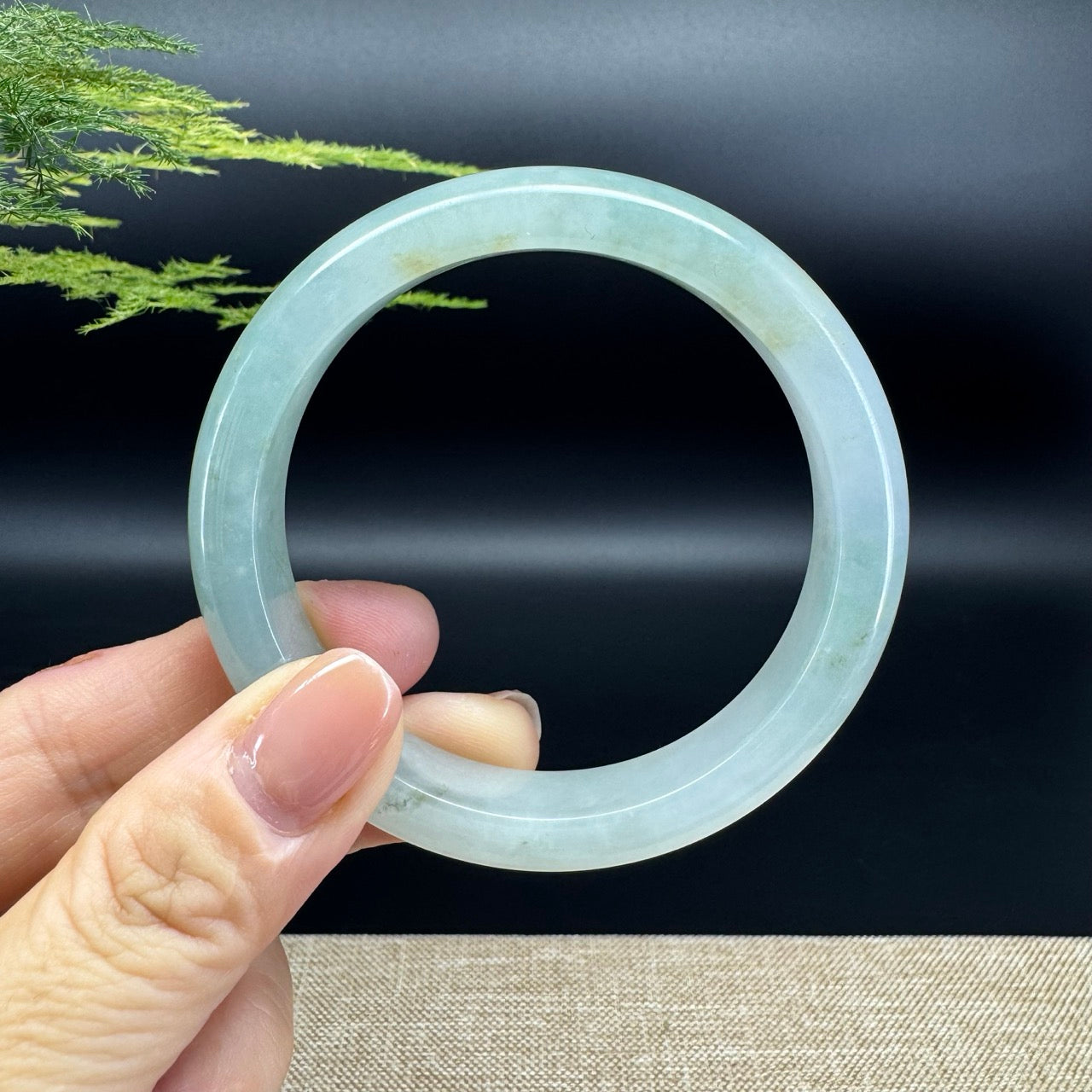 The bangle shape of the half round.The bangle color is yellow green